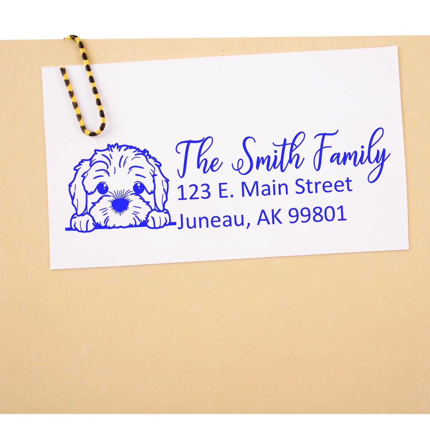 Custom return address rubber stamp with dog illustration for The Smith Family, 123 E. Main Street, Juneau, AK 99801