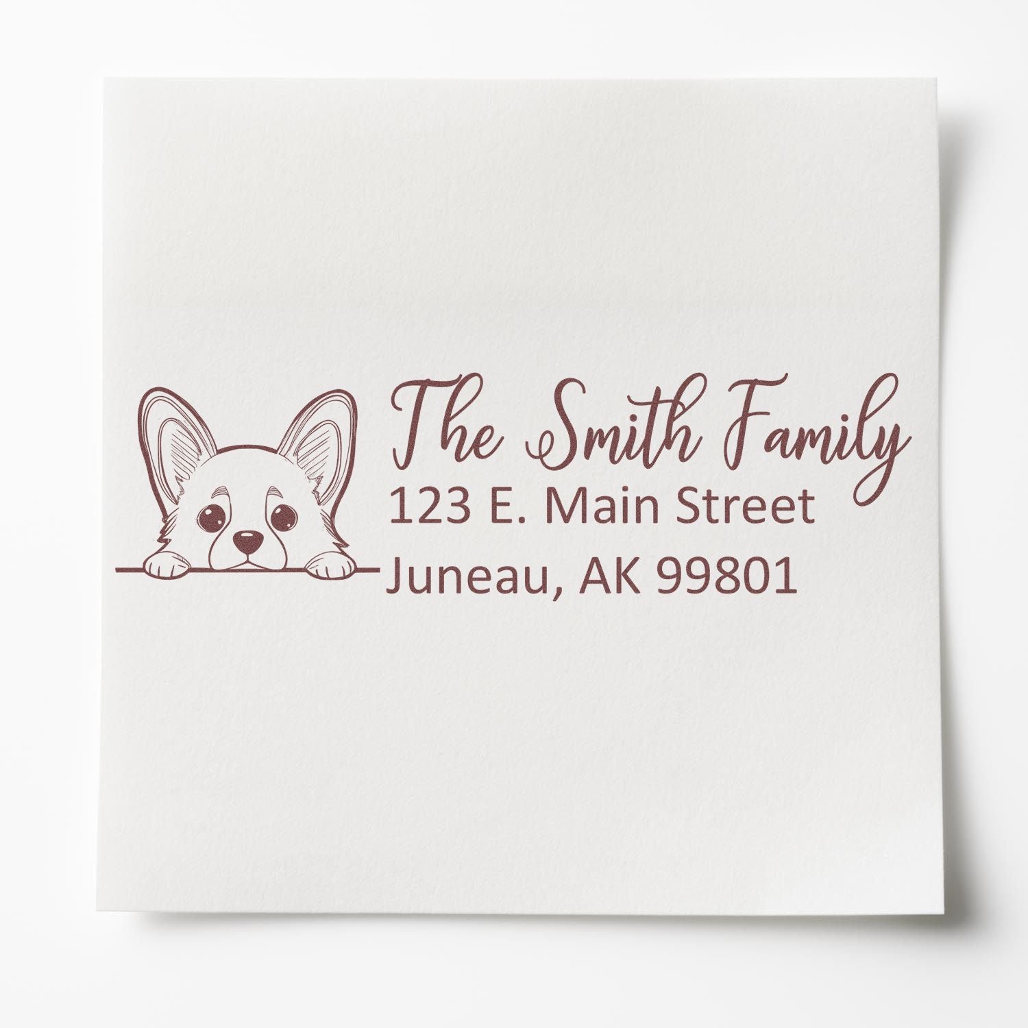 Custom corgi return address rubber stamp with The Smith Family name and Juneau, AK address for envelopes.