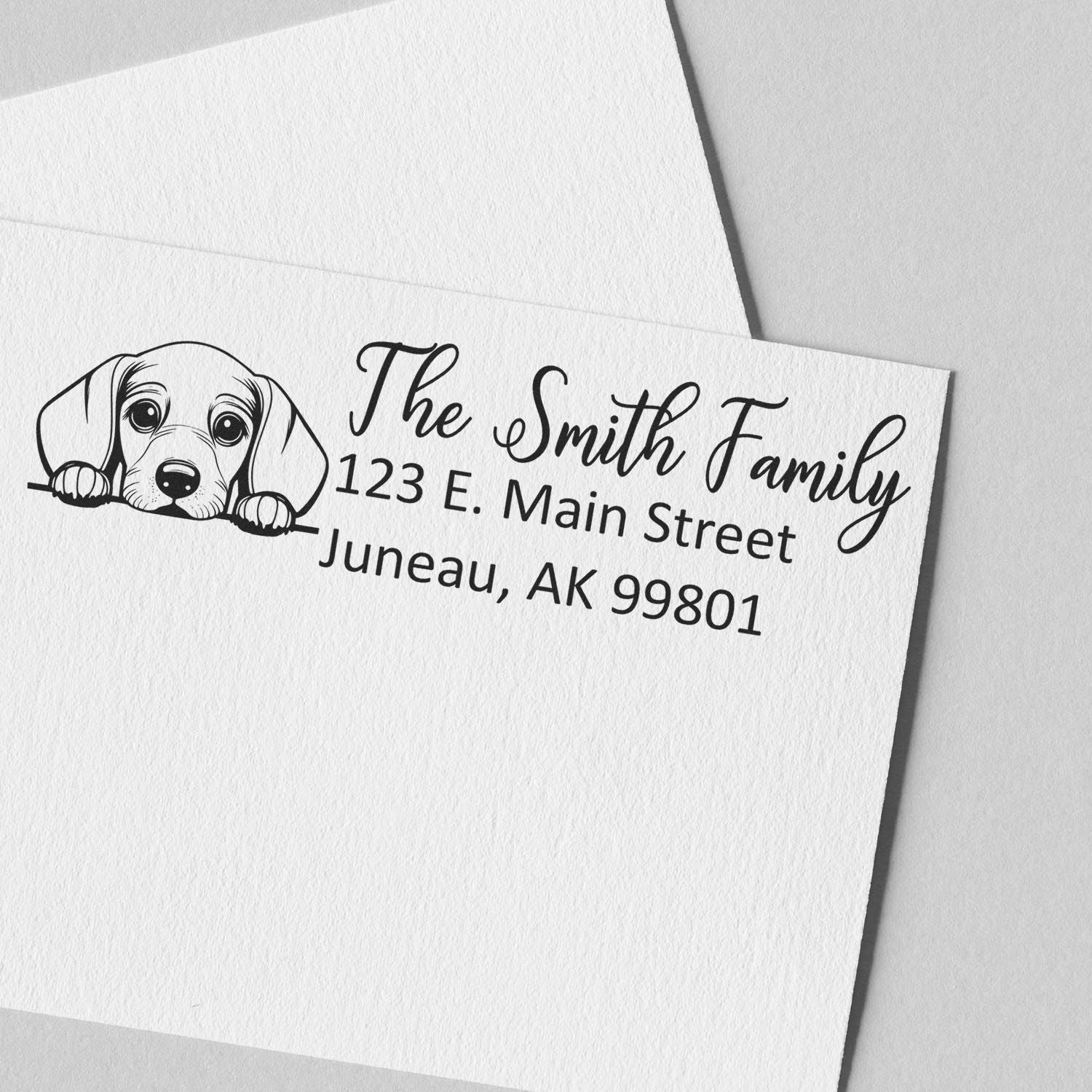 Custom dog return address rubber stamp for The Smith Family, featuring a puppy illustration and mailing address.