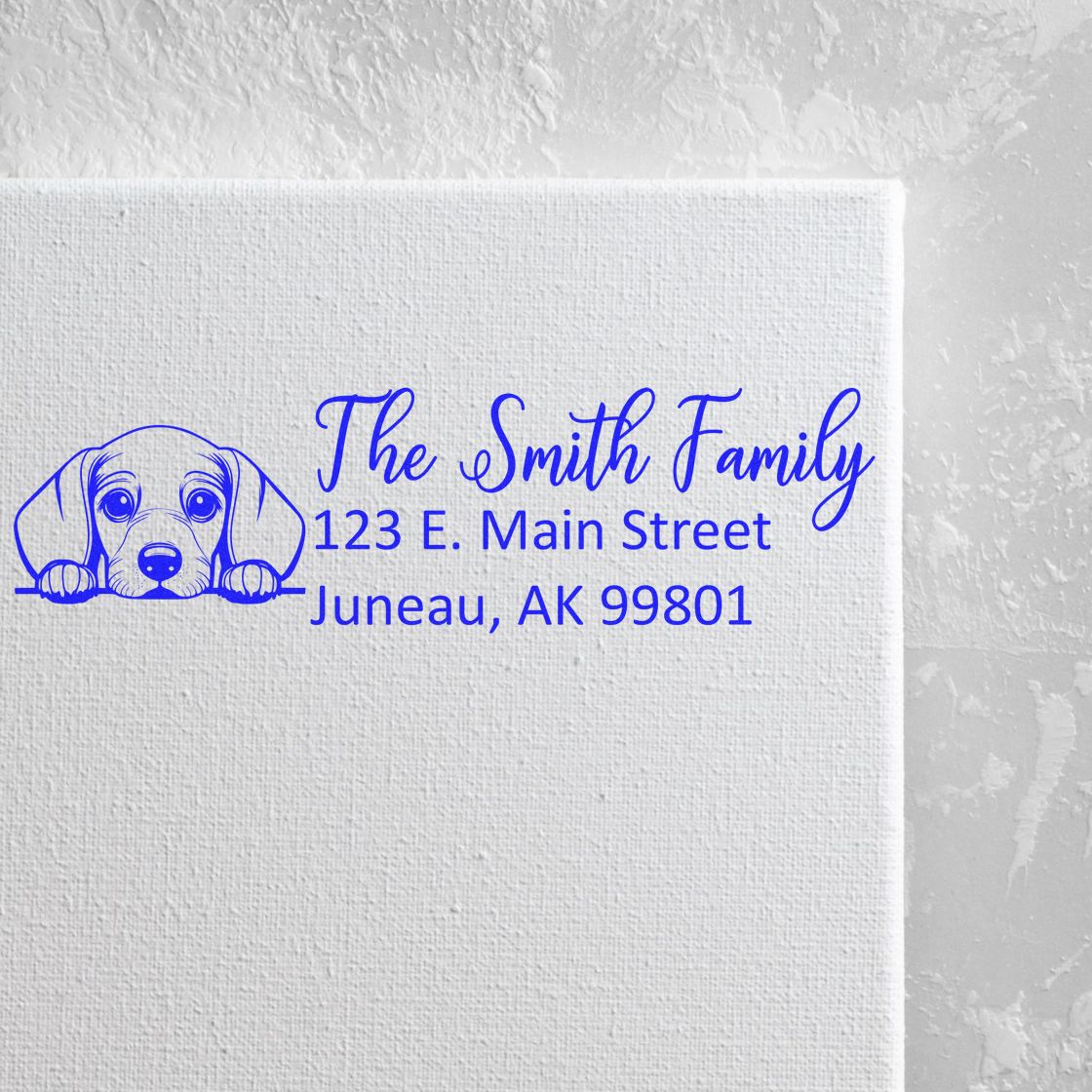 Custom rubber stamp with dog illustration and return address for The Smith Family, Juneau, AK 99801.