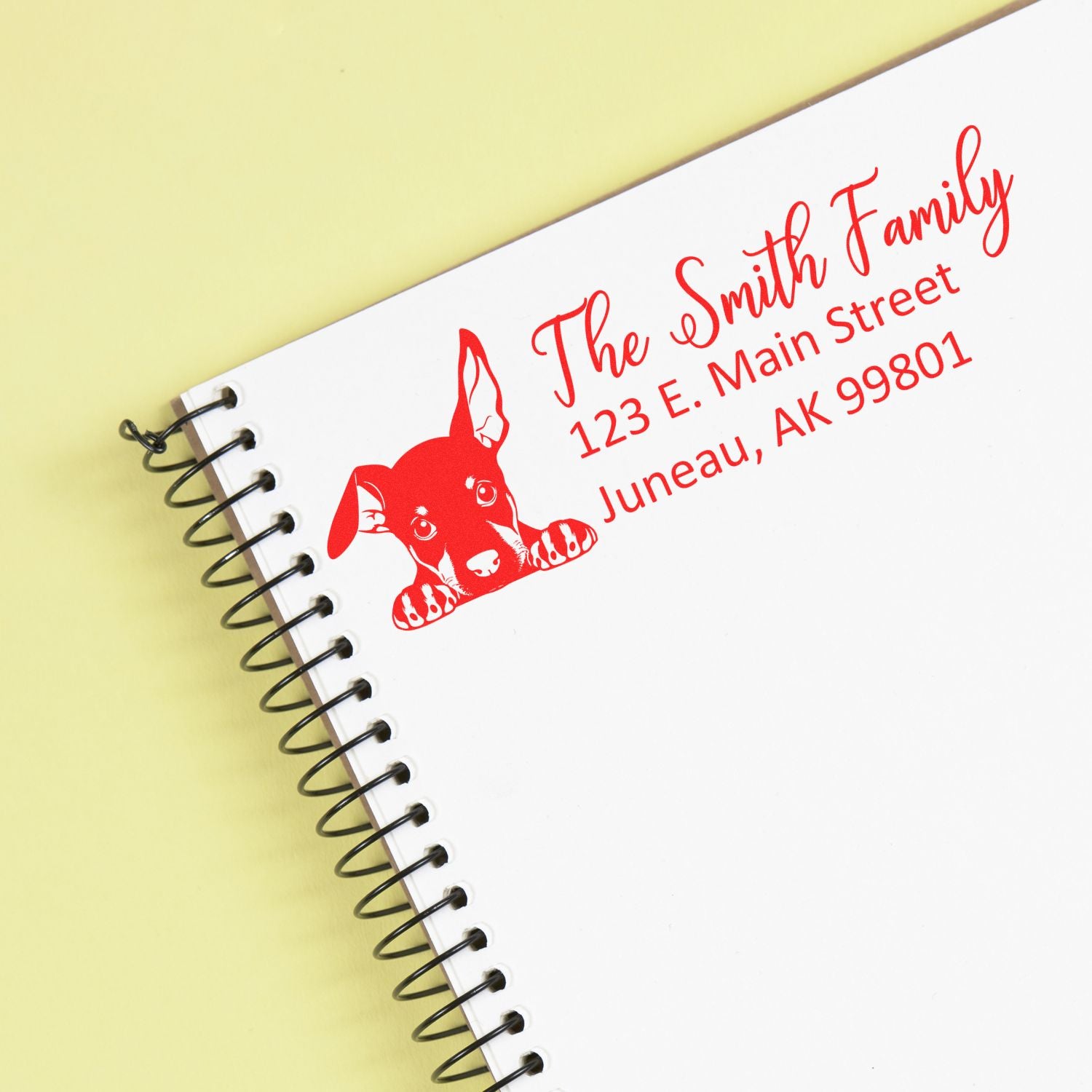 Custom return address rubber stamp with dog design for The Smith Family, Juneau, AK 99801.