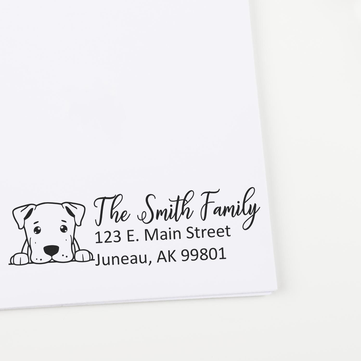 Personalized return address rubber stamp with dog illustration for The Smith Family, Juneau AK mailing and stationery.