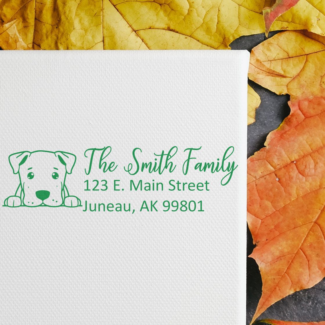 Personalized return address rubber stamp with dog icon for The Smith Family, 123 E. Main Street, Juneau, AK.