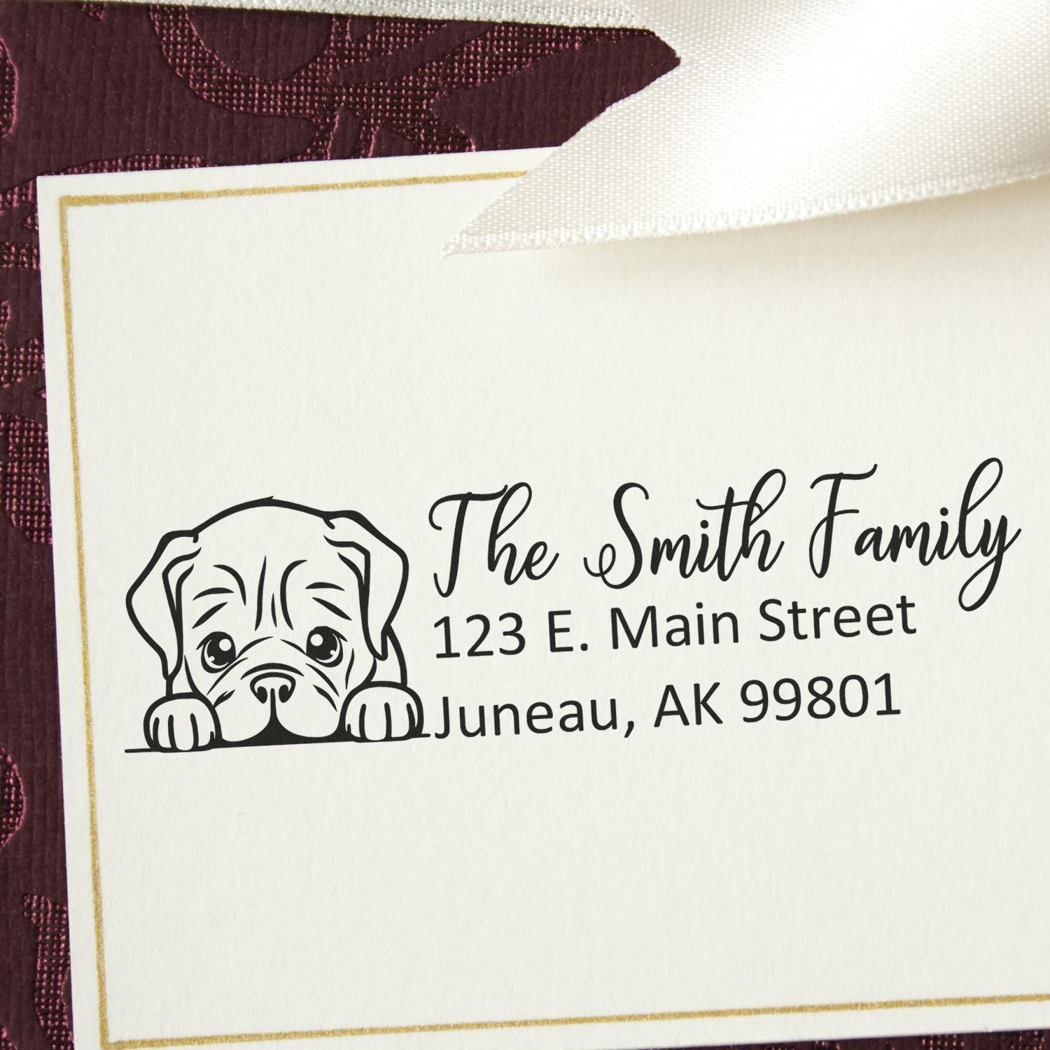 Personalized rubber address stamp with dog illustration for The Smith Family, featuring custom return address on stationery.