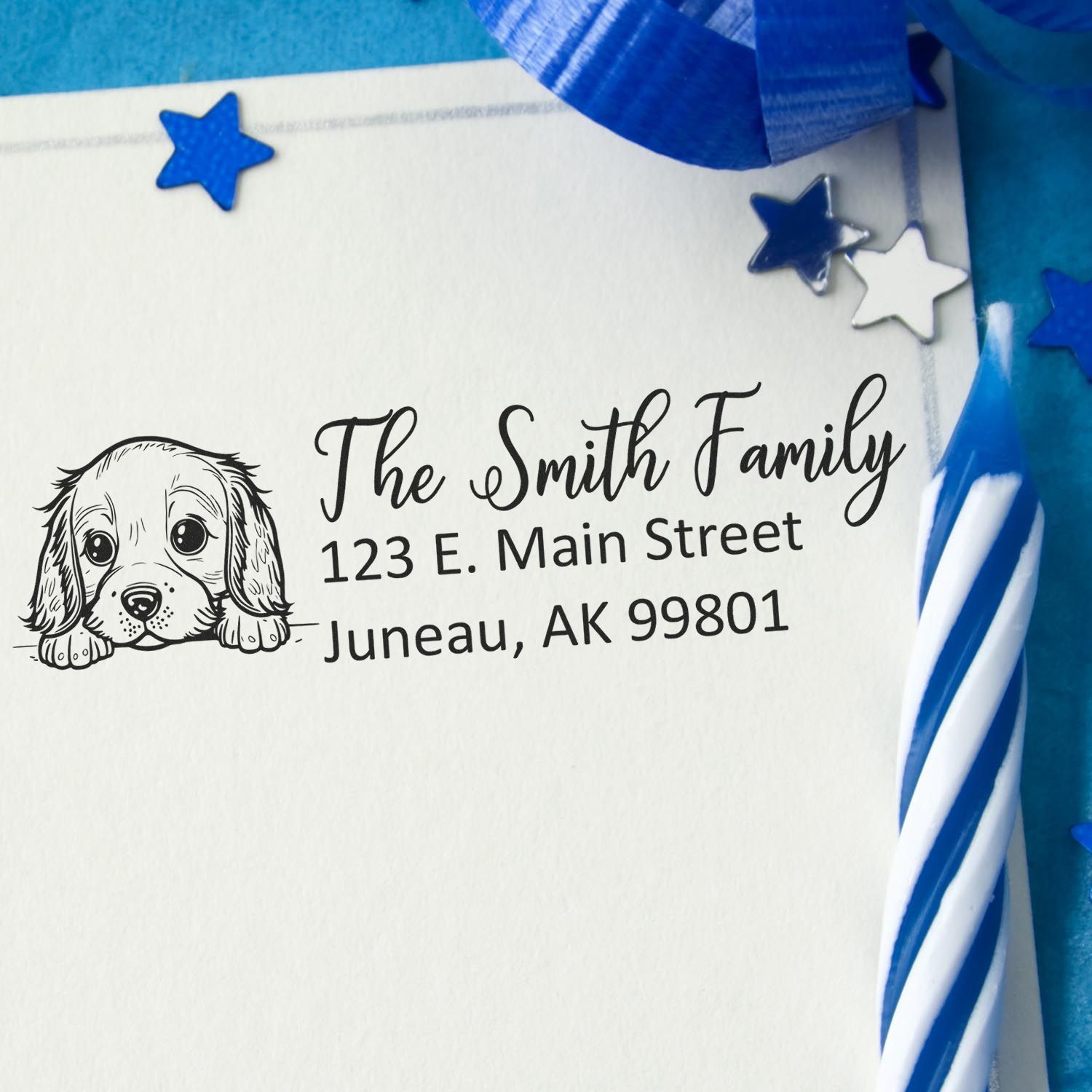 Custom return address rubber stamp with dog design for The Smith Family, 123 E. Main Street, Juneau, AK 99801.