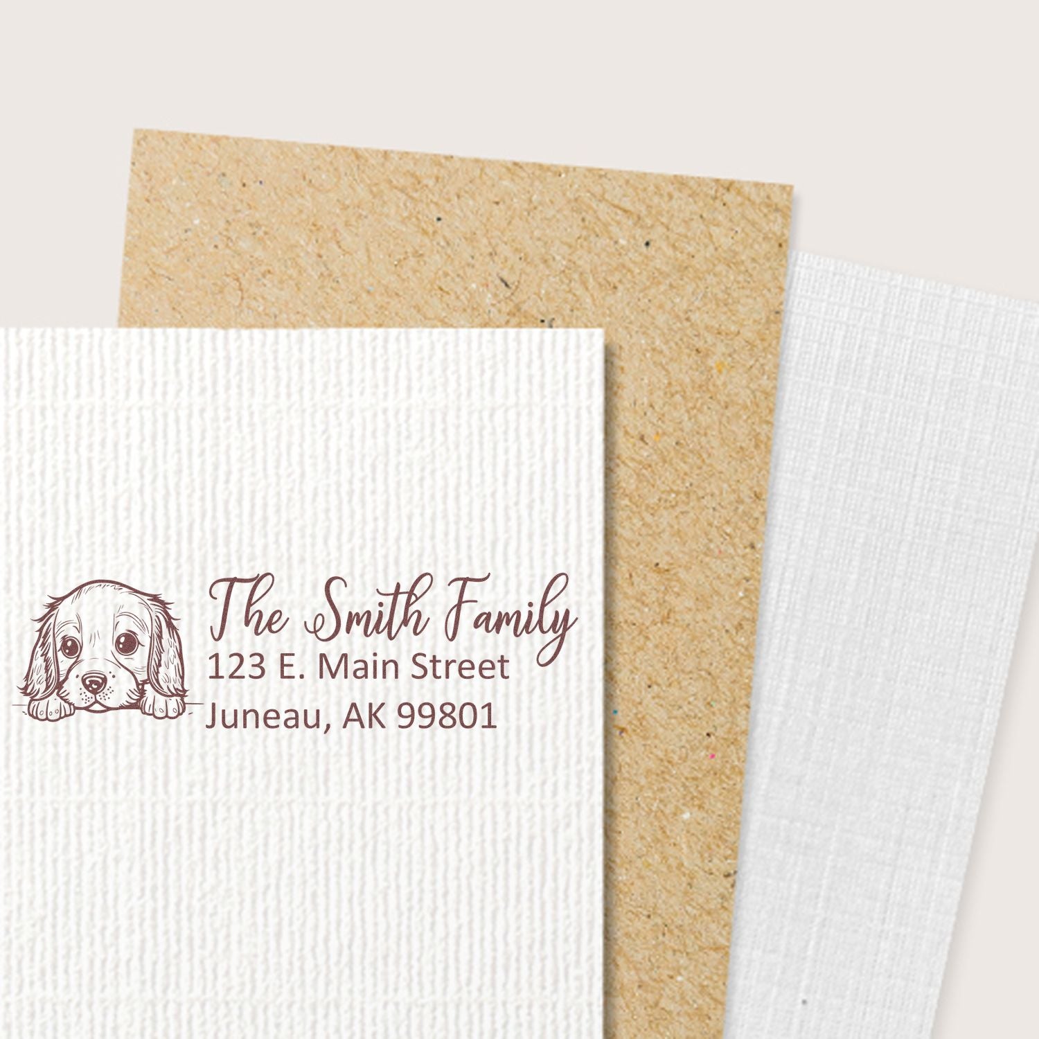 Personalized rubber address stamp with dog illustration for The Smith Family, ideal for custom return address on envelopes.