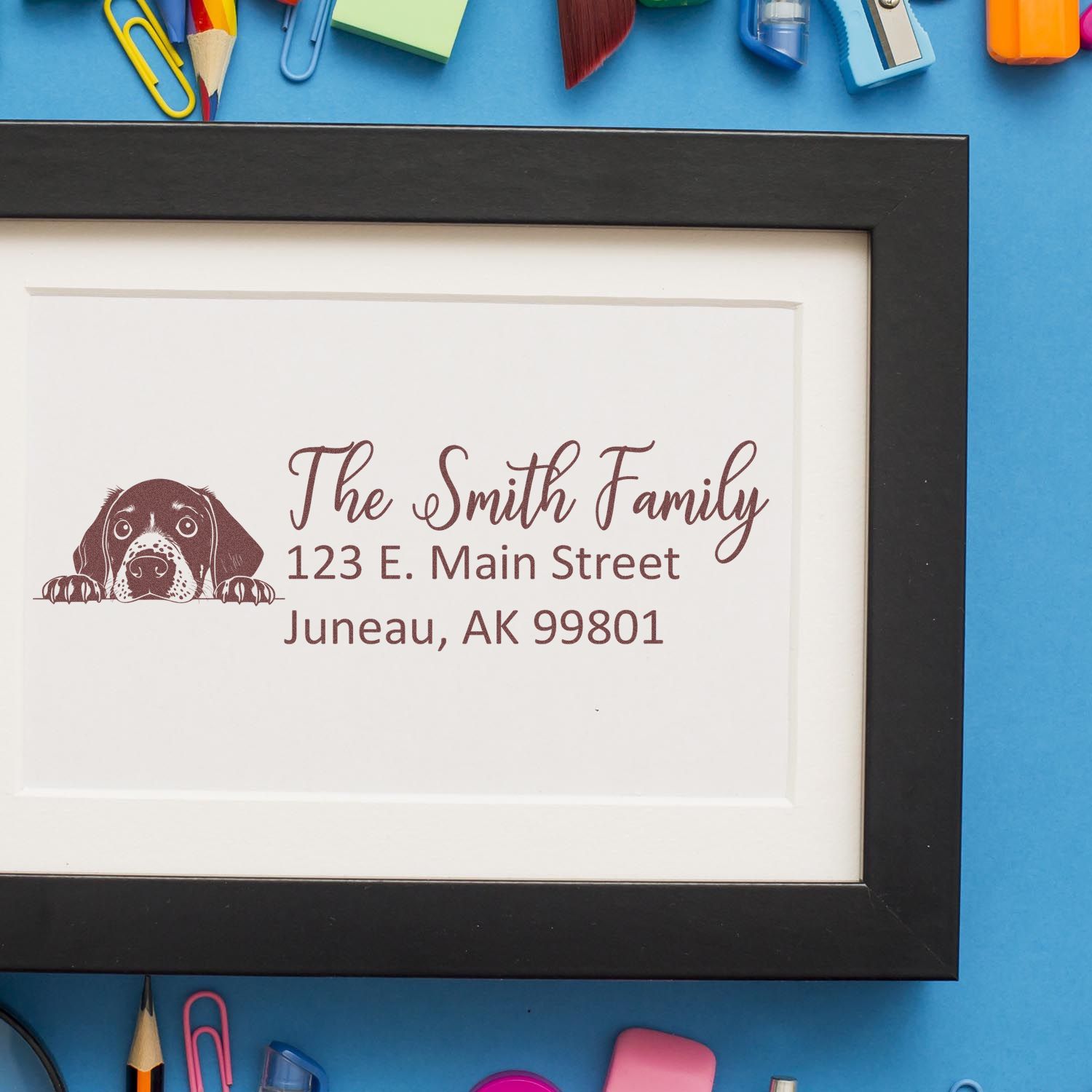 Custom address rubber stamp for The Smith Family with dog illustration and Juneau, AK return address.