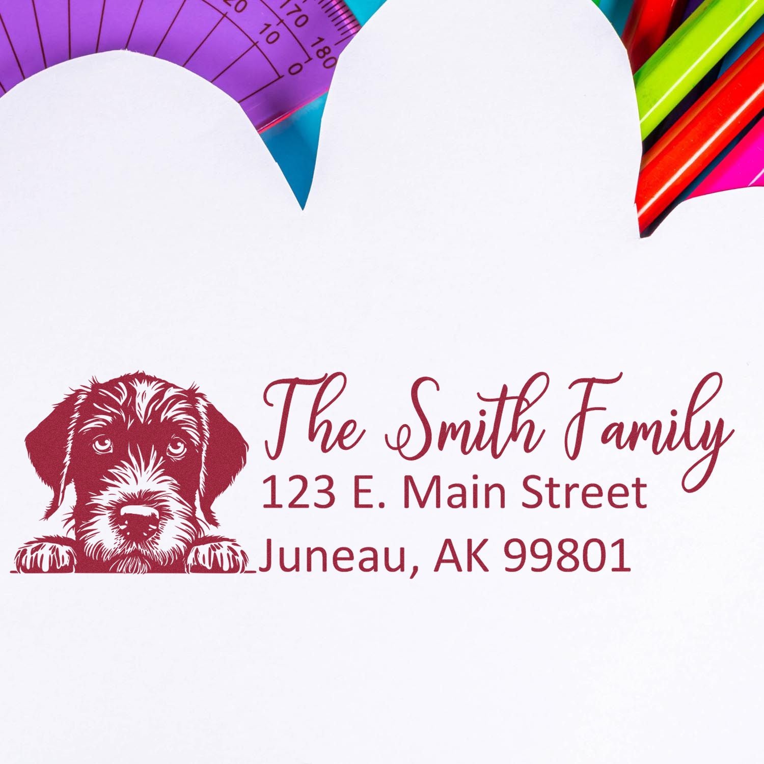 Custom rubber stamp with dog illustration and personalized return address for The Smith Family, Juneau, AK 99801