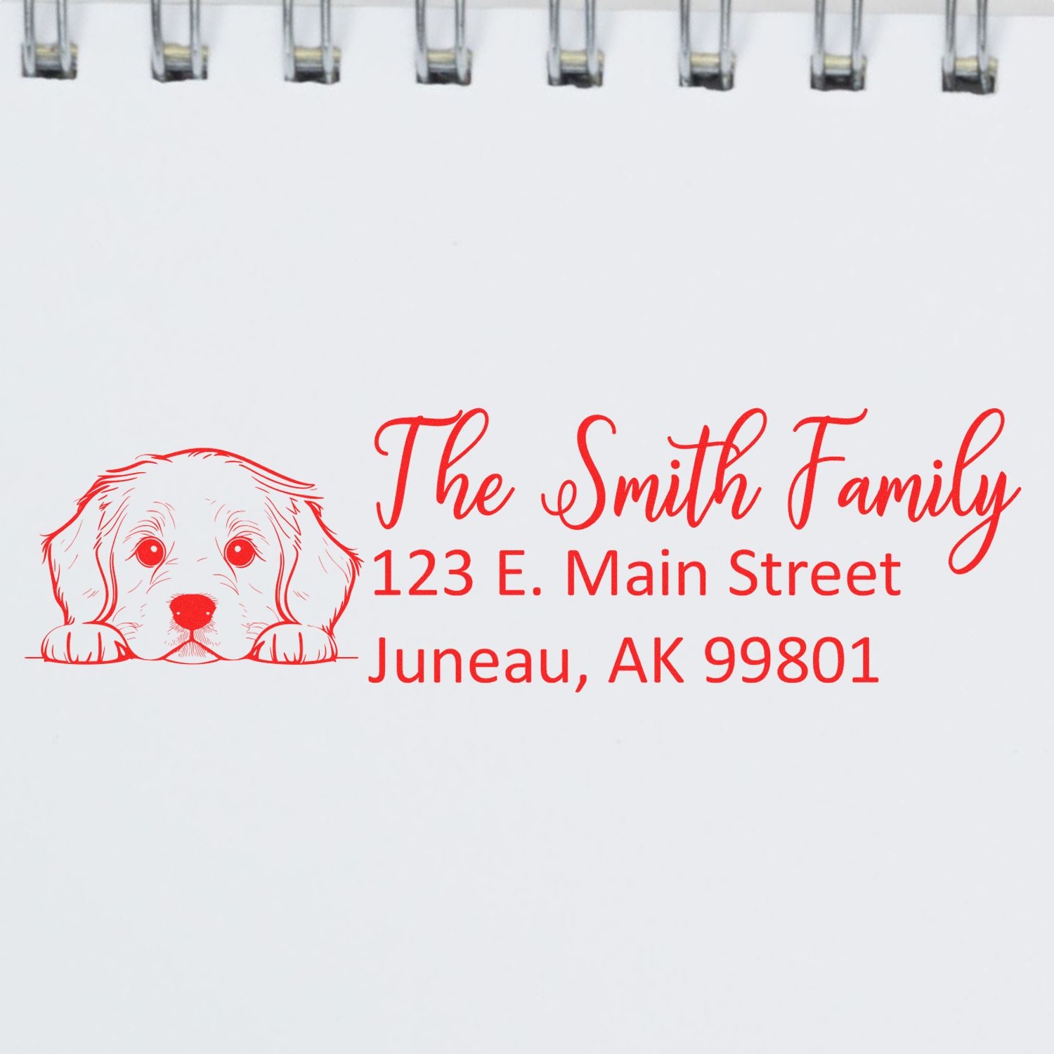 Custom family return address rubber stamp with dog illustration and red text: The Smith Family, 123 E. Main Street, Juneau, AK 99801.
