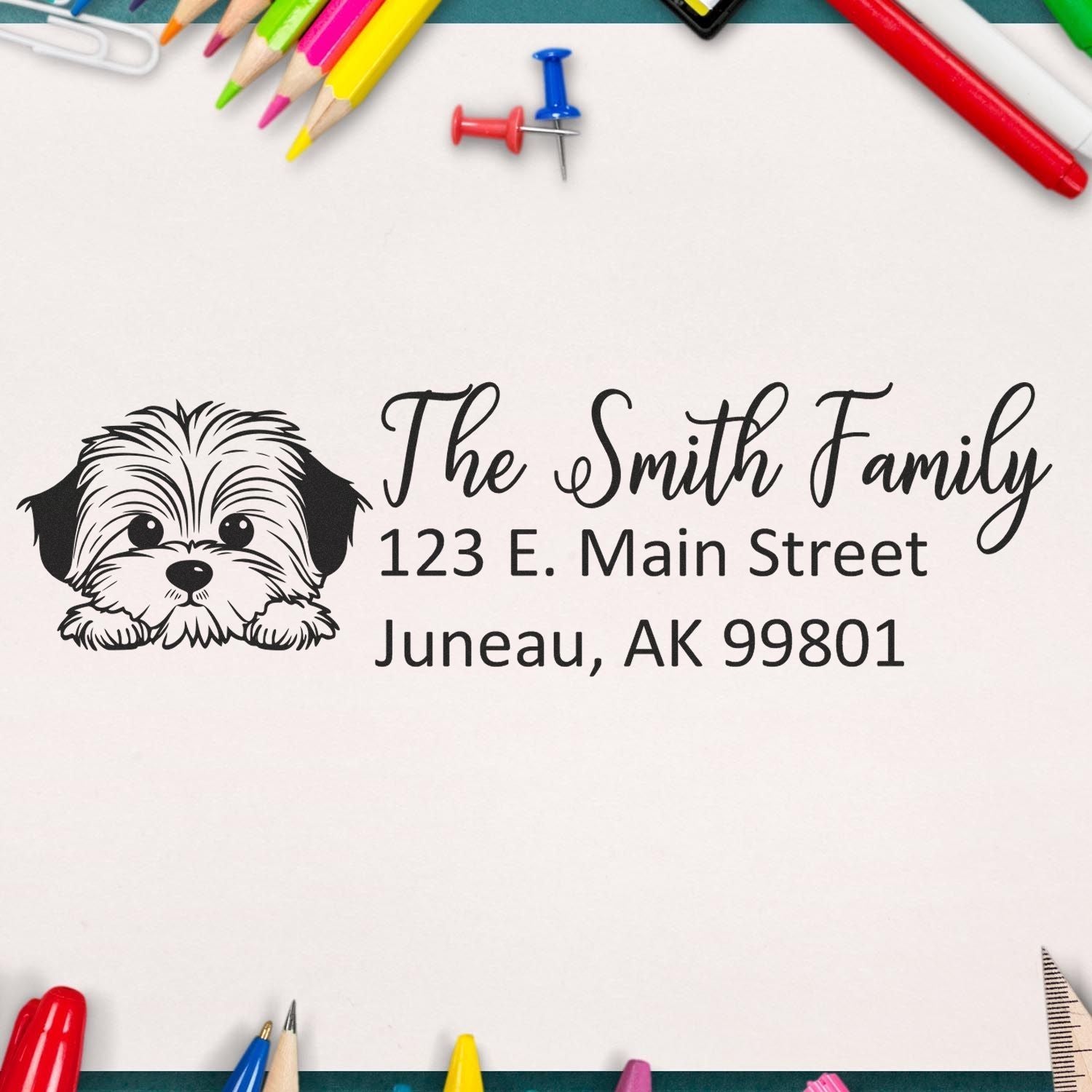 Custom rubber return address stamp with dog illustration for The Smith Family, Juneau, AK 99801
