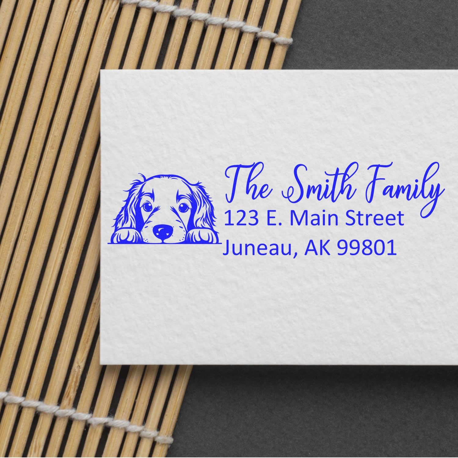 Personalized return address rubber stamp with dog illustration for The Smith Family, Juneau, AK 99801