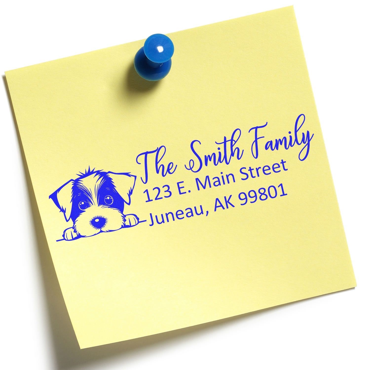 Custom return address rubber stamp with dog illustration printed on a yellow sticky note.