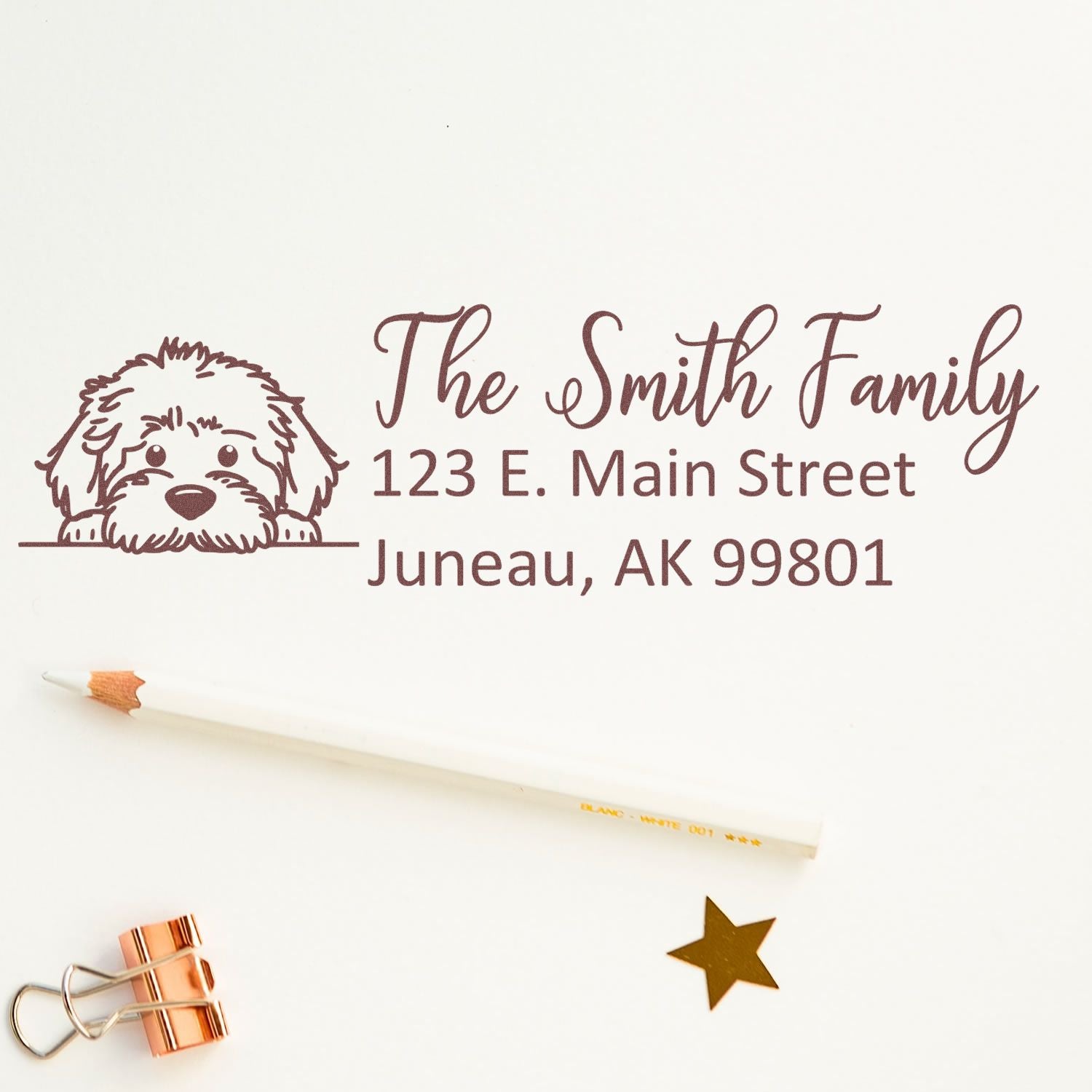 Custom rubber stamp with dog illustration and personalized return address for The Smith Family, Juneau, AK 99801.