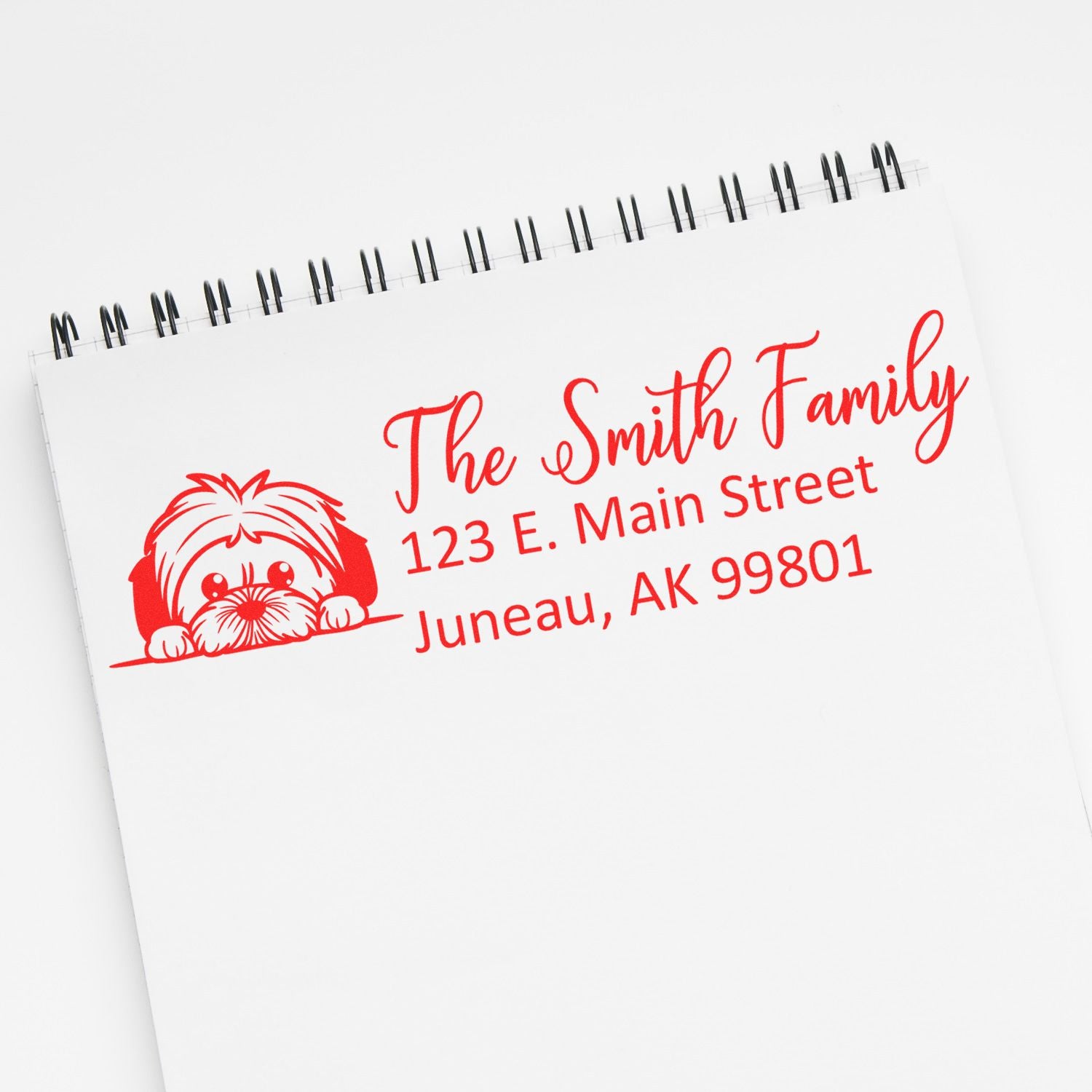 Custom return address rubber stamp with dog graphic for The Smith Family, Juneau, AK.