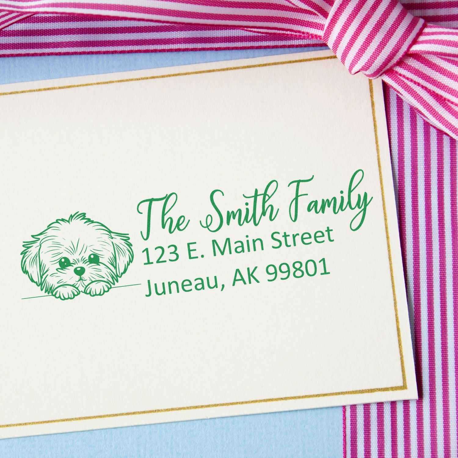 Personalized rubber address stamp with dog illustration for The Smith Family, Juneau, Alaska.