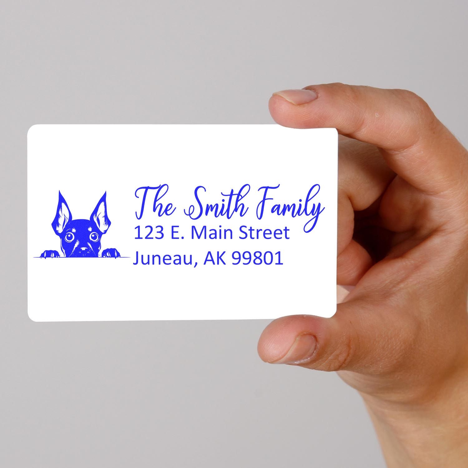 Custom rubber address stamp with dog logo, The Smith Family name, and Juneau, AK return address.