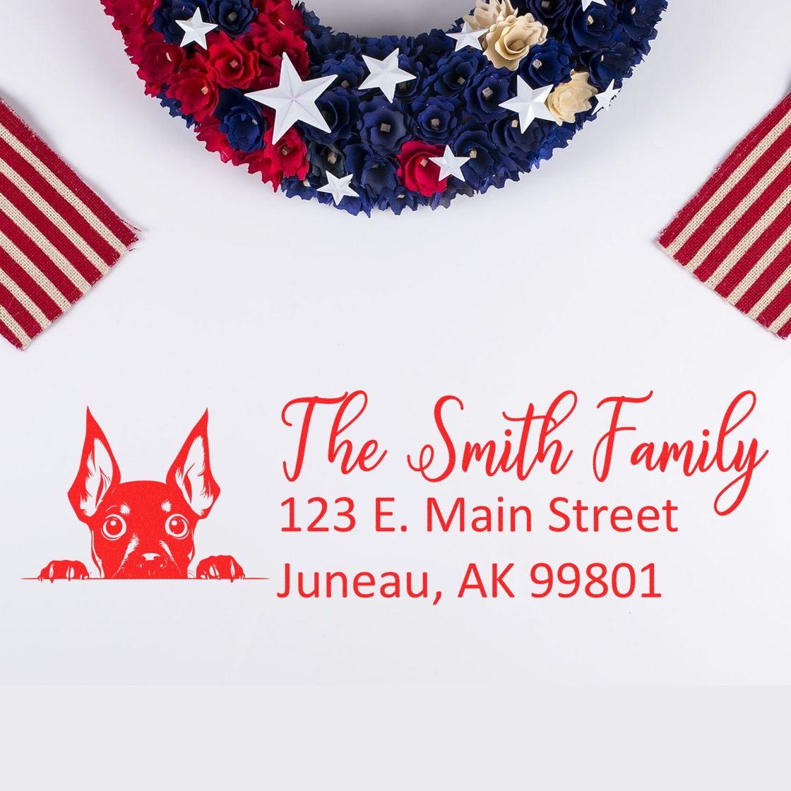 Custom rubber stamp return address for The Smith Family with dog design, 123 E. Main Street, Juneau, AK 99801.