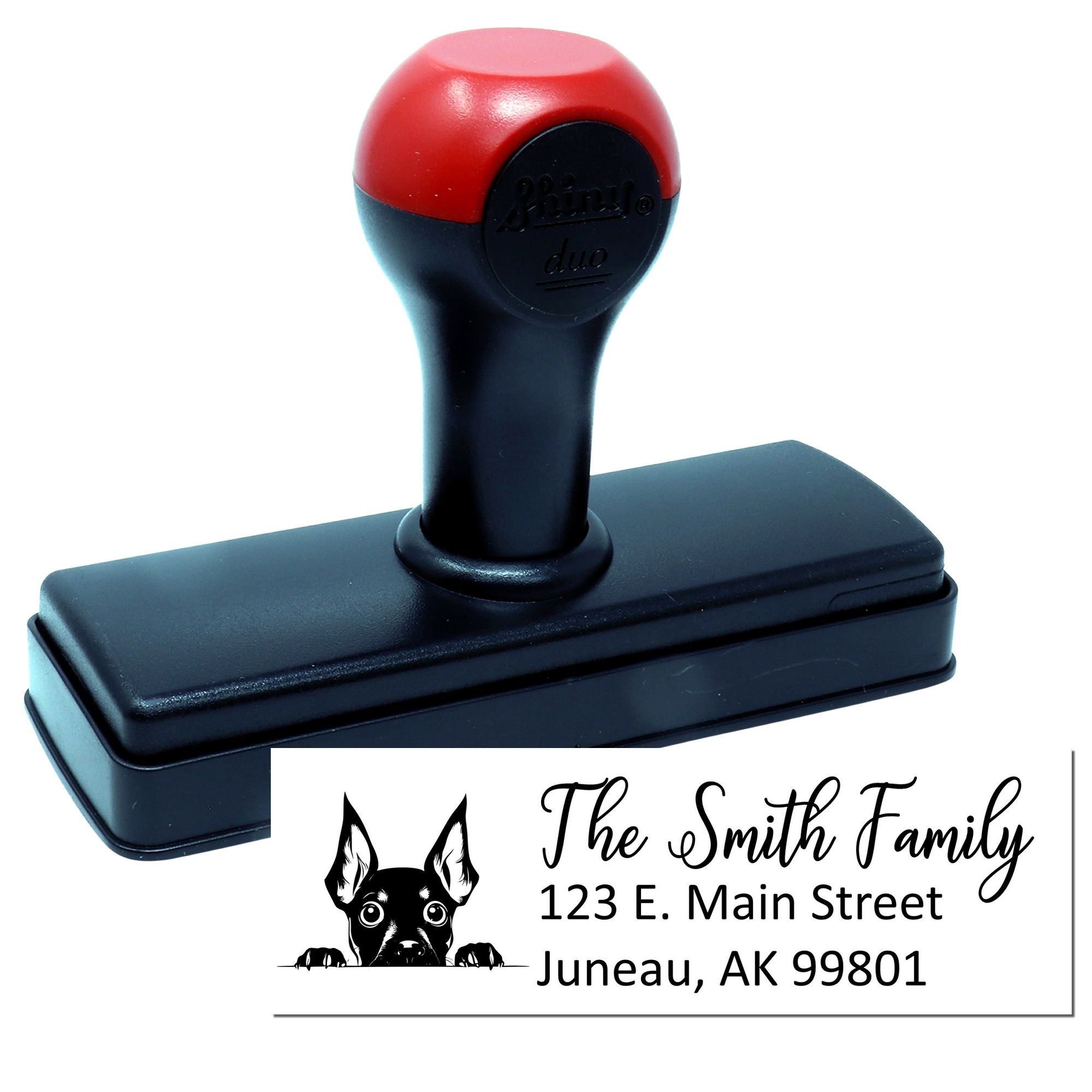 Custom self-inking rubber address stamp with dog logo for The Smith Family in Juneau, AK.
