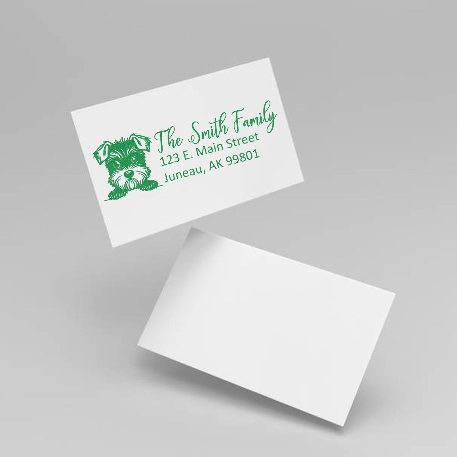 Custom return address rubber stamp with dog design for The Smith Family, 123 E. Main Street, Juneau, AK 99801.