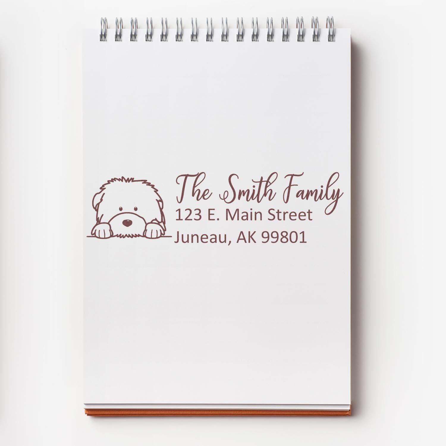 Custom return address rubber stamp with dog illustration for The Smith Family, Juneau, AK 99801