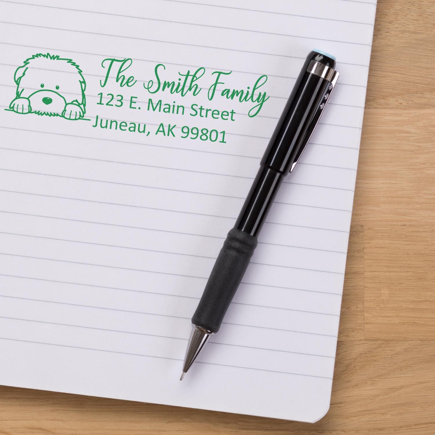 Custom return address rubber stamp with dog illustration for The Smith Family, Juneau, AK.