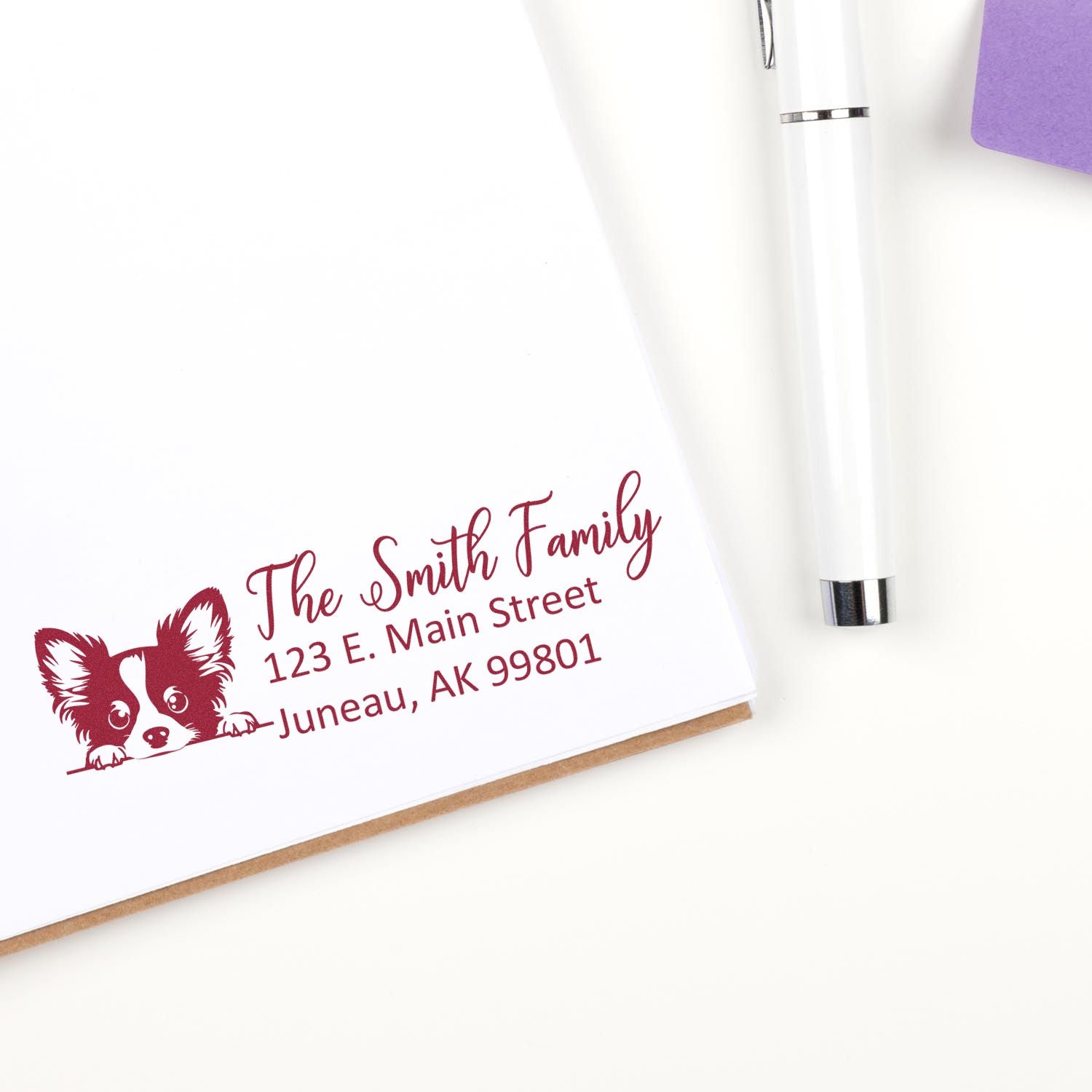 Custom family address rubber stamp with dog design, showing The Smith Family, street address, and Juneau, AK.
