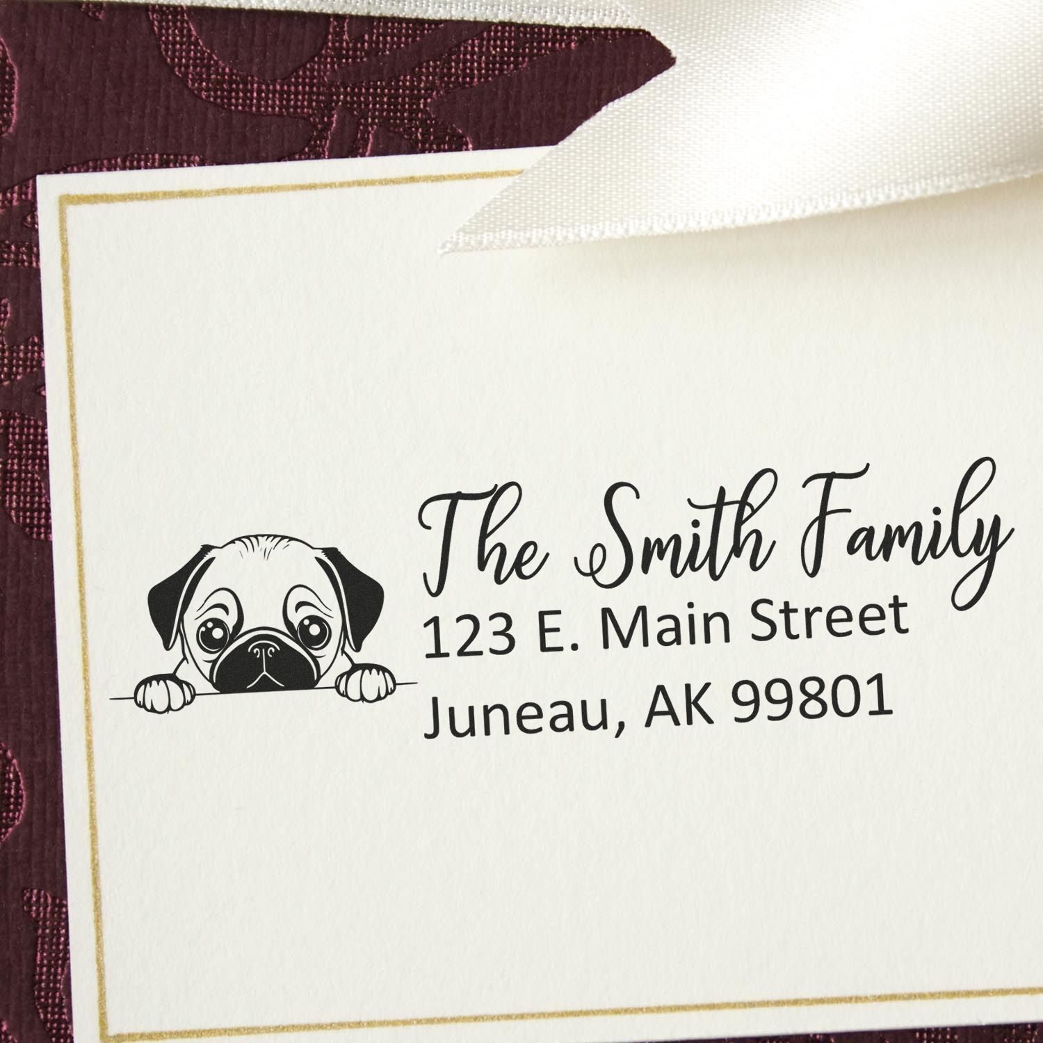 Custom rubber return address stamp with pug illustration for The Smith Family, Juneau, AK 99801.