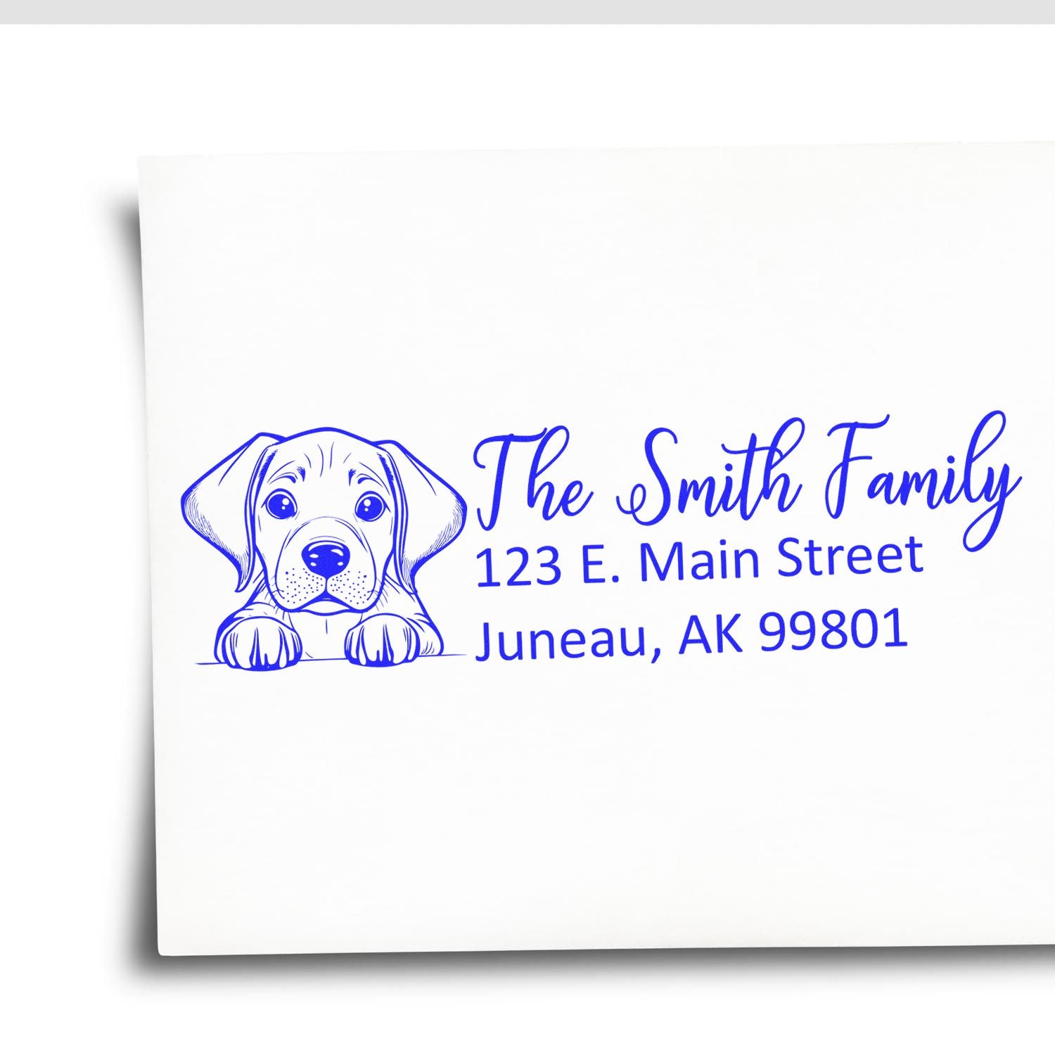 Custom return address rubber stamp with dog illustration, The Smith Family, 123 E. Main Street, Juneau, AK 99801.