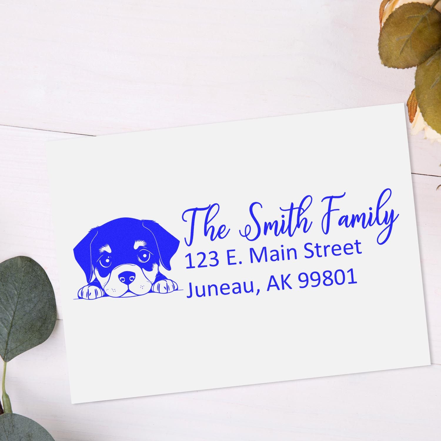 Custom return address rubber stamp with puppy design for The Smith Family, 123 E. Main Street, Juneau, AK.