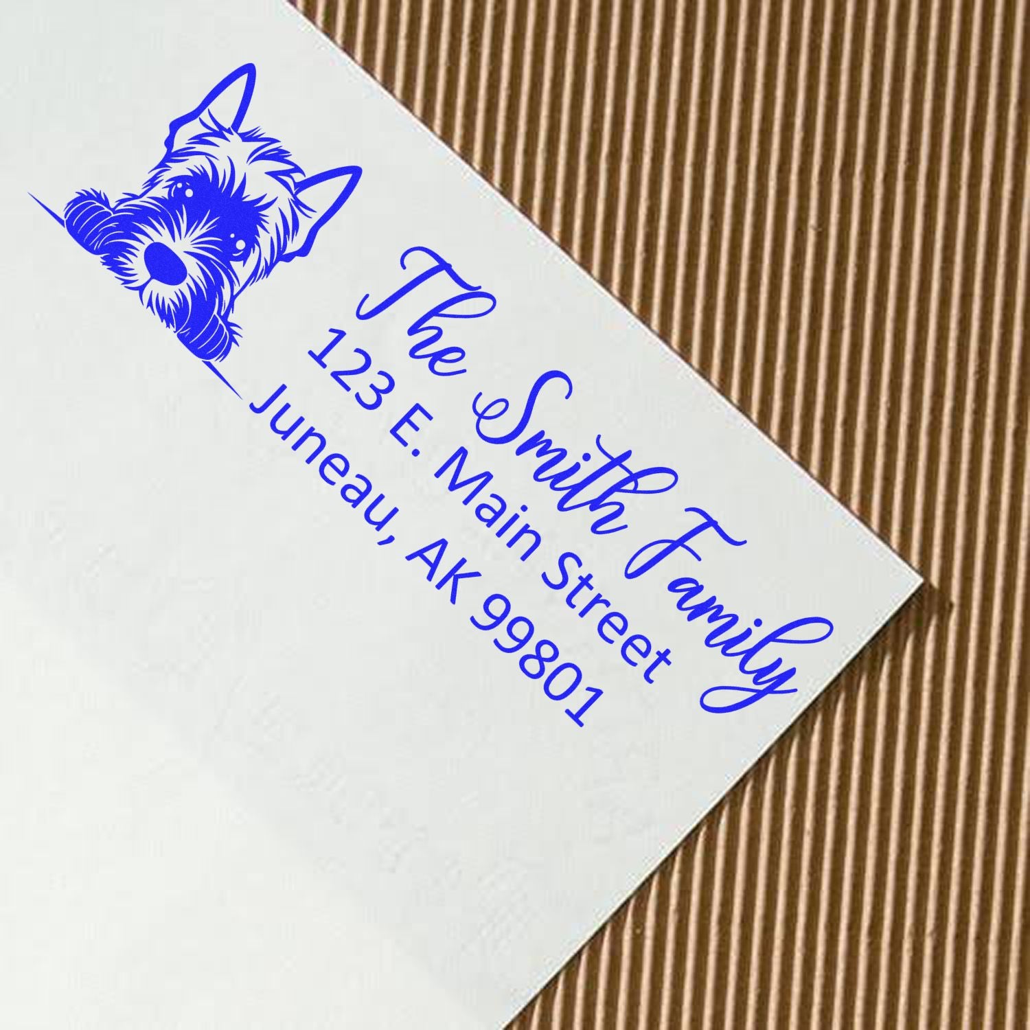 Custom rubber stamp return address with dog logo for The Smith Family, printed in blue on a white envelope.