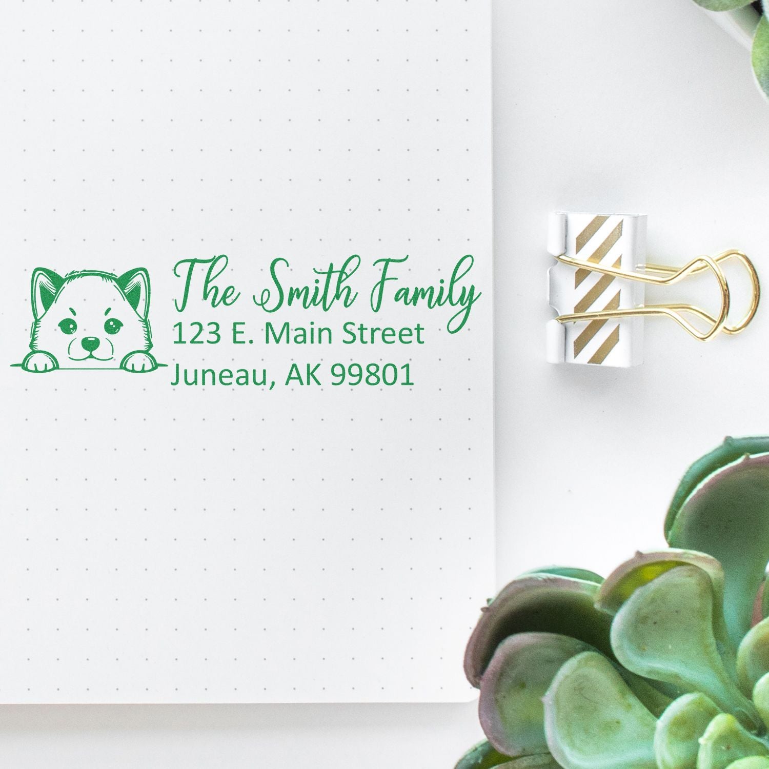 Custom return address rubber stamp with dog design for The Smith Family, featuring Juneau, AK mailing address.