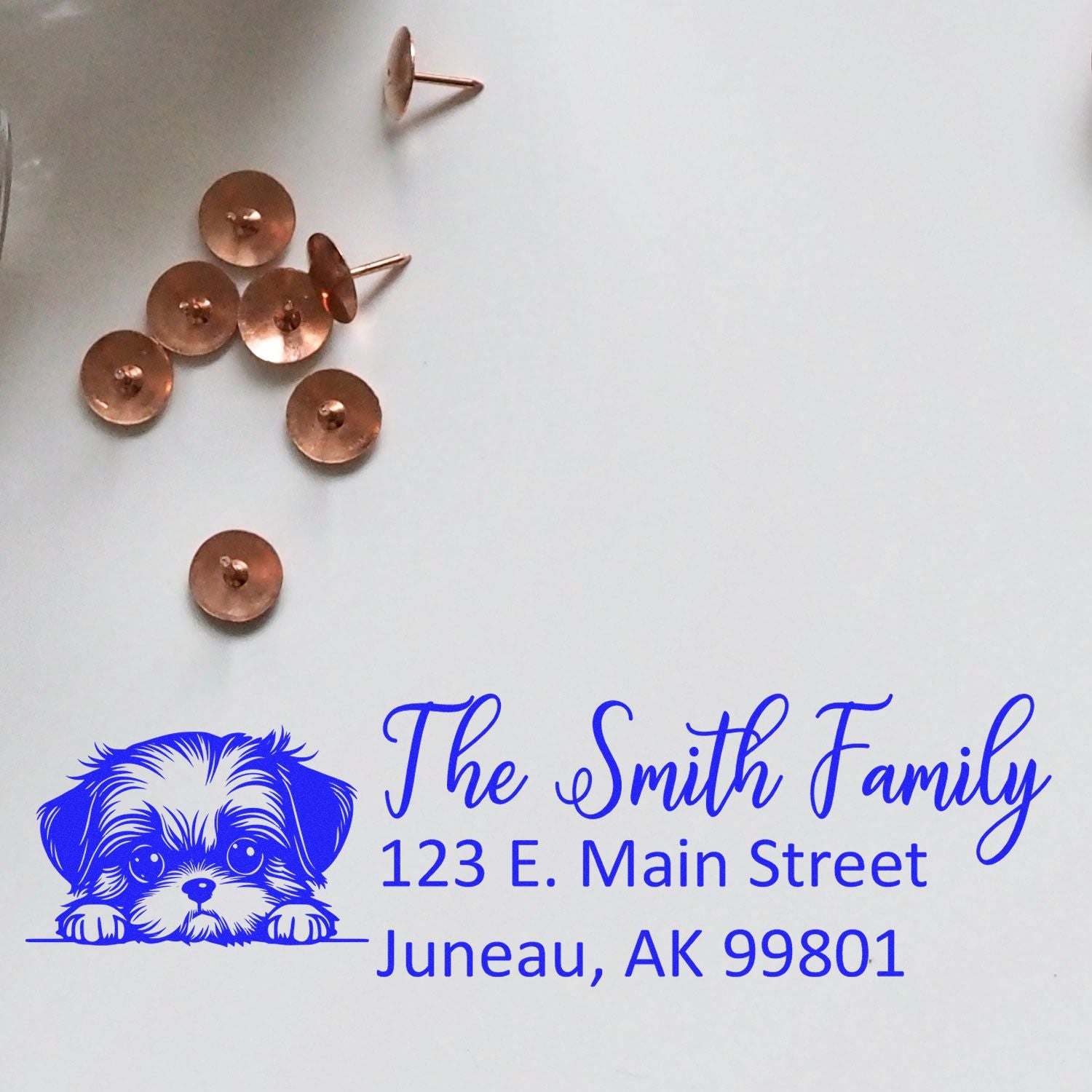 Sample dog-themed custom address rubber stamp imprint for The Smith Family, Juneau, AK 99801.