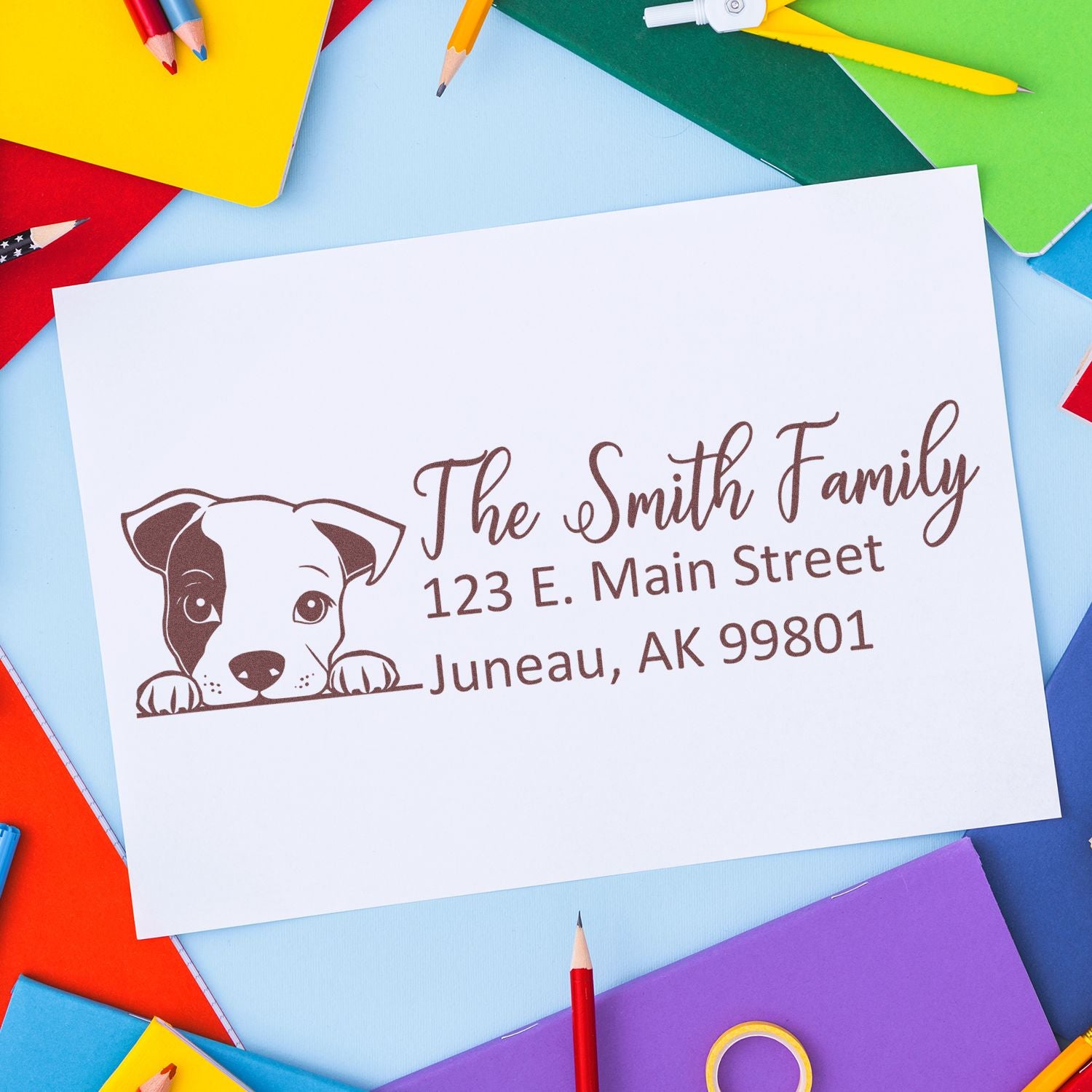 Personalized dog return address rubber stamp impression with The Smith Family and Juneau, AK address.