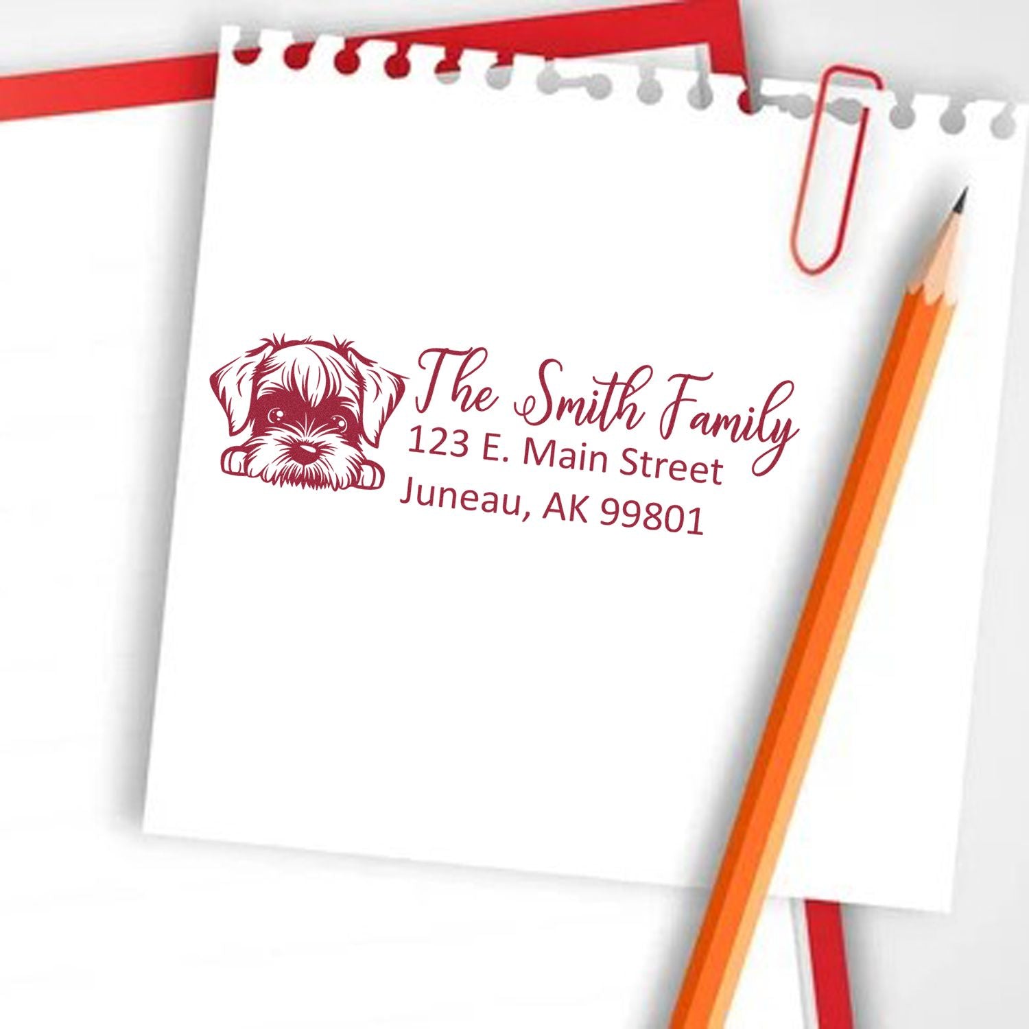 Custom return address rubber stamp with dog design for The Smith Family, 123 E. Main Street, Juneau, AK.