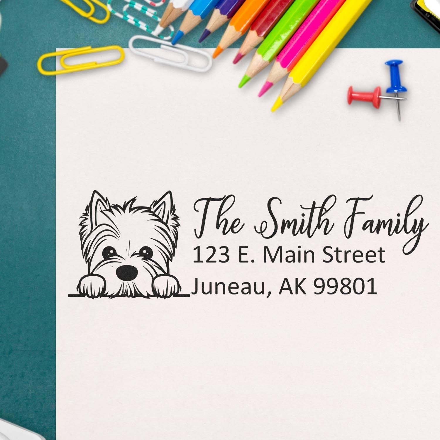 Personalized rubber stamp with dog logo and return address for The Smith Family, Juneau, AK 99801.