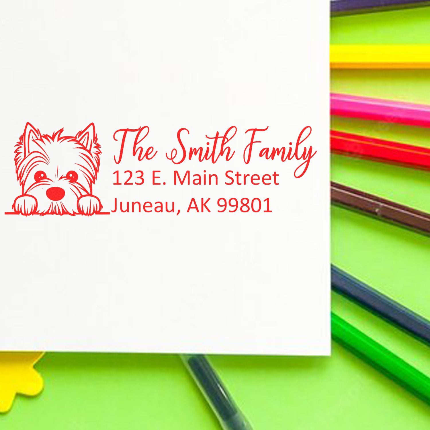 Custom return address rubber stamp with dog design for The Smith Family, Juneau, AK, ideal for envelopes.