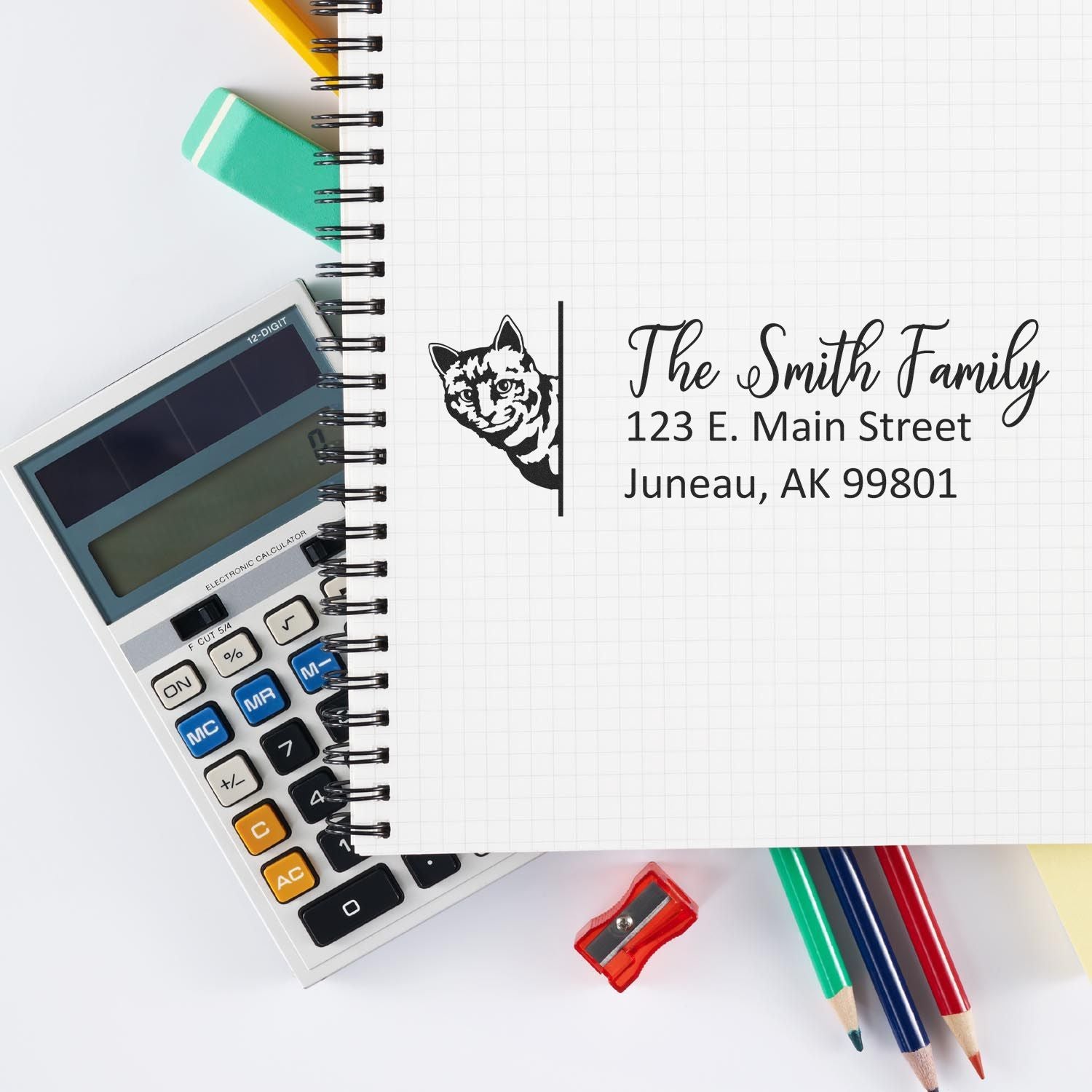 Custom return address rubber stamp for The Smith Family with cat logo and full mailing address.