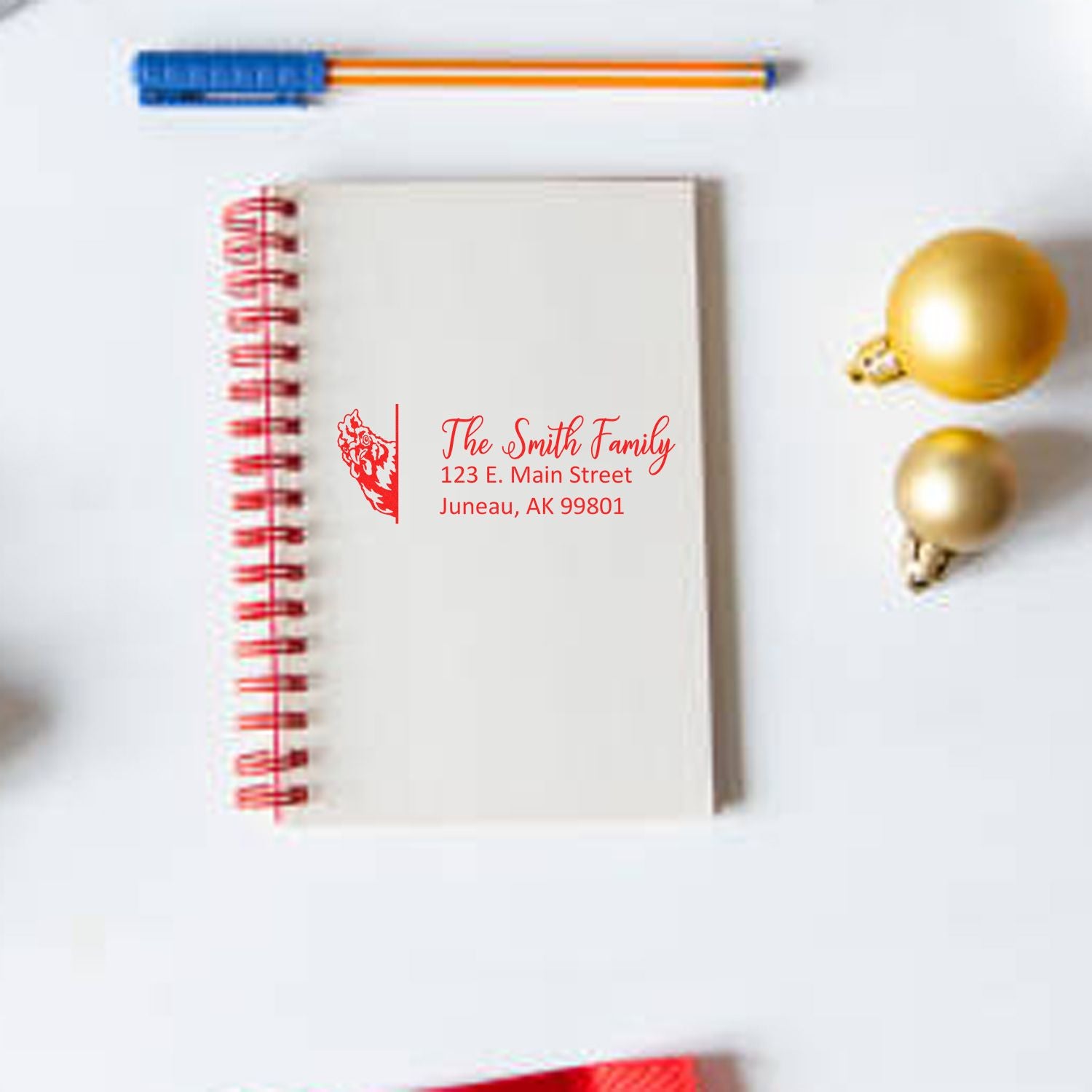Custom return address rubber stamp on notebook, featuring The Smith Family address for personalized stationery and holiday cards.
