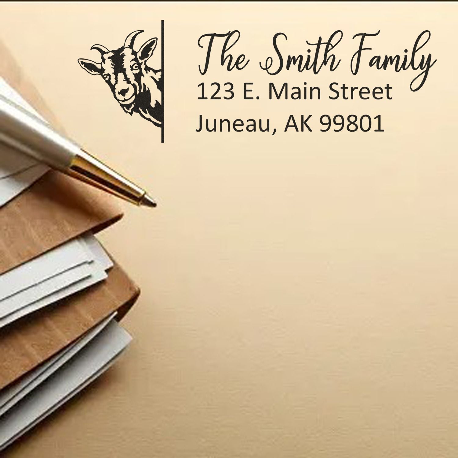 Custom rubber address stamp with goat logo, The Smith Family name and Juneau, AK mailing address for envelopes.