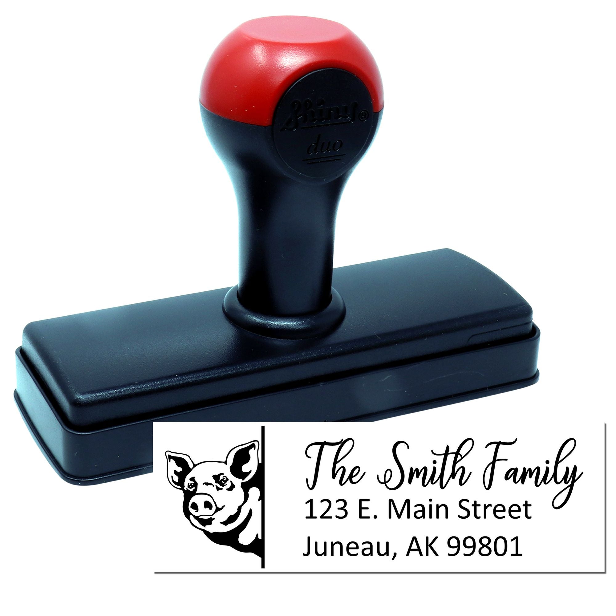 Custom self-inking rubber stamp with dog logo and family return address for envelopes and mail.