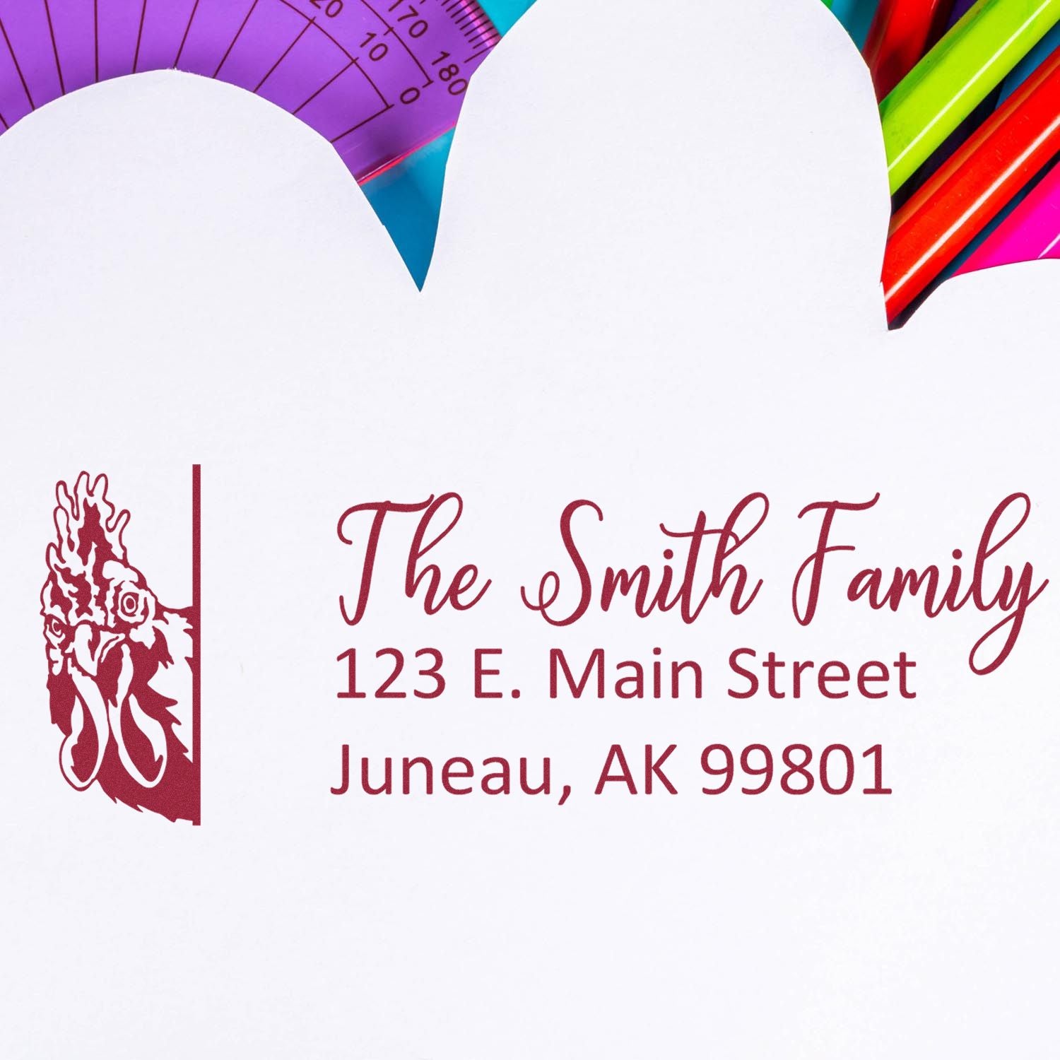 Personalized rubber address stamp for The Smith Family, featuring floral monogram and custom return address, Juneau, AK 99801