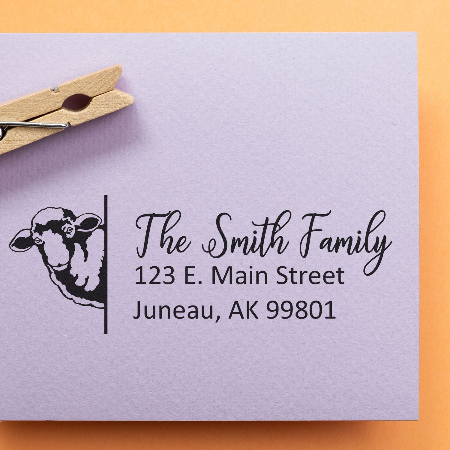 Custom family address rubber stamp with sheep design for The Smith Family, 123 E. Main Street, Juneau, AK 99801