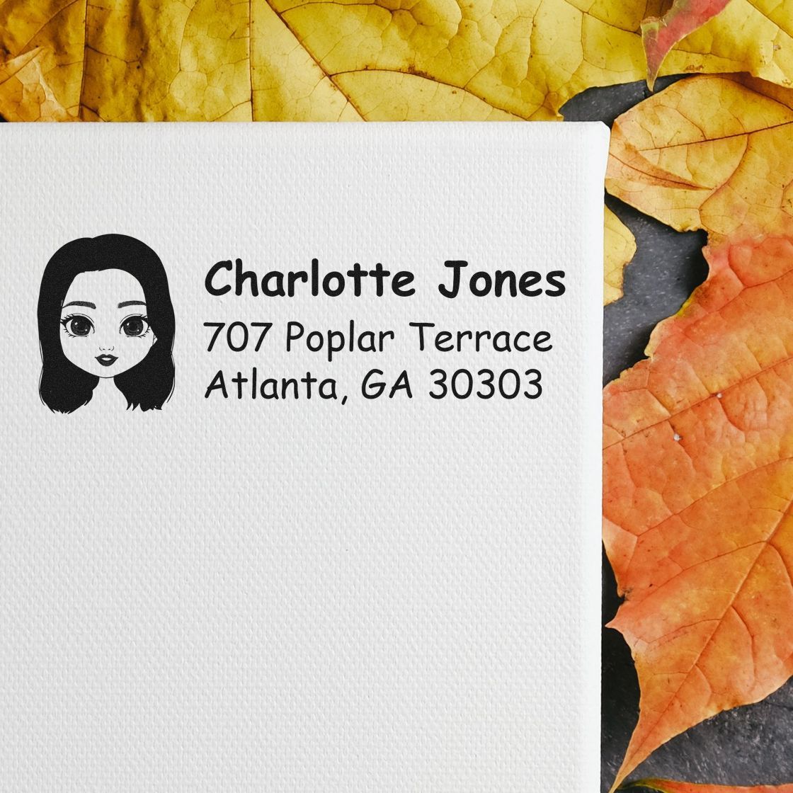 Personalized address rubber stamp for Charlotte Jones, 707 Poplar Terrace, Atlanta, GA 30303 with illustrated face logo