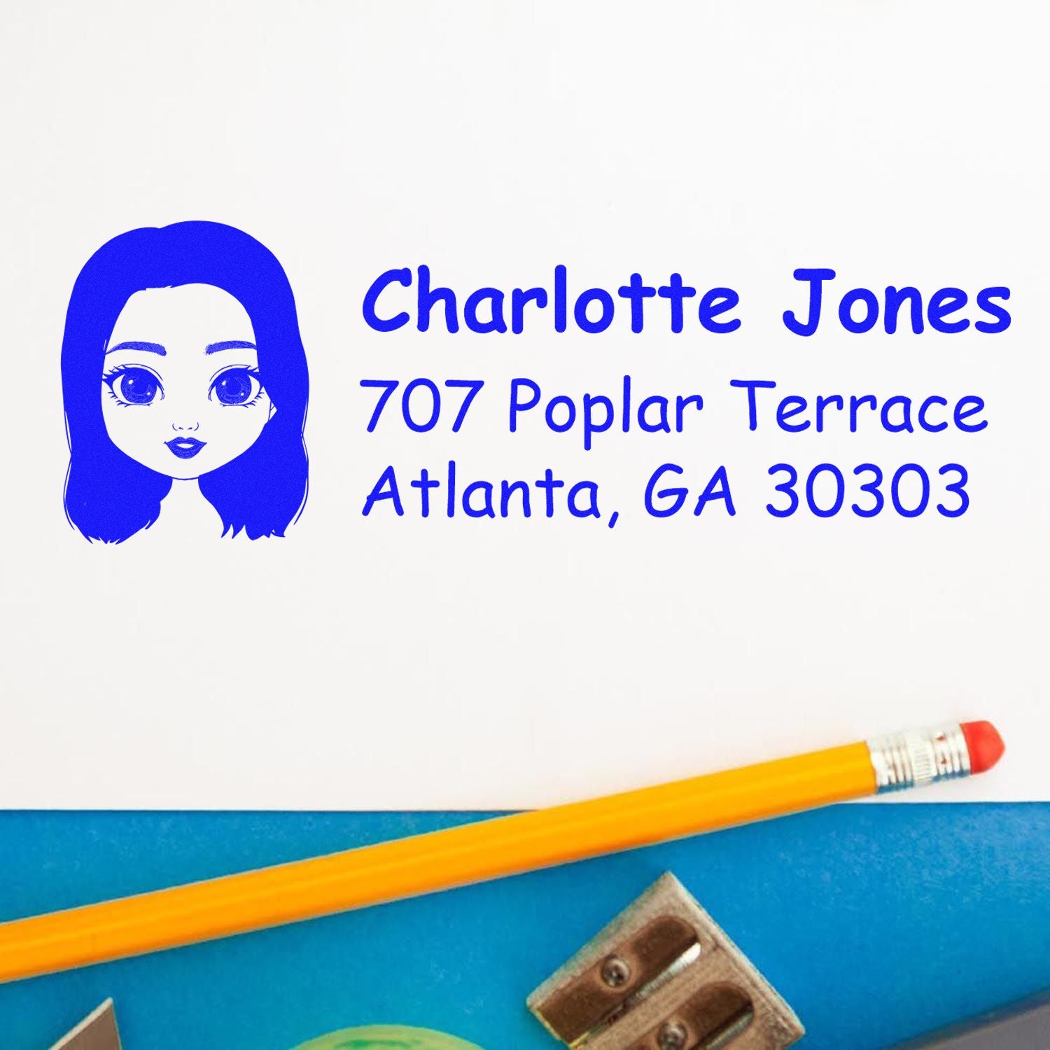 Custom return address rubber stamp with avatar art for Charlotte Jones, 707 Poplar Terrace, Atlanta, GA 30303
