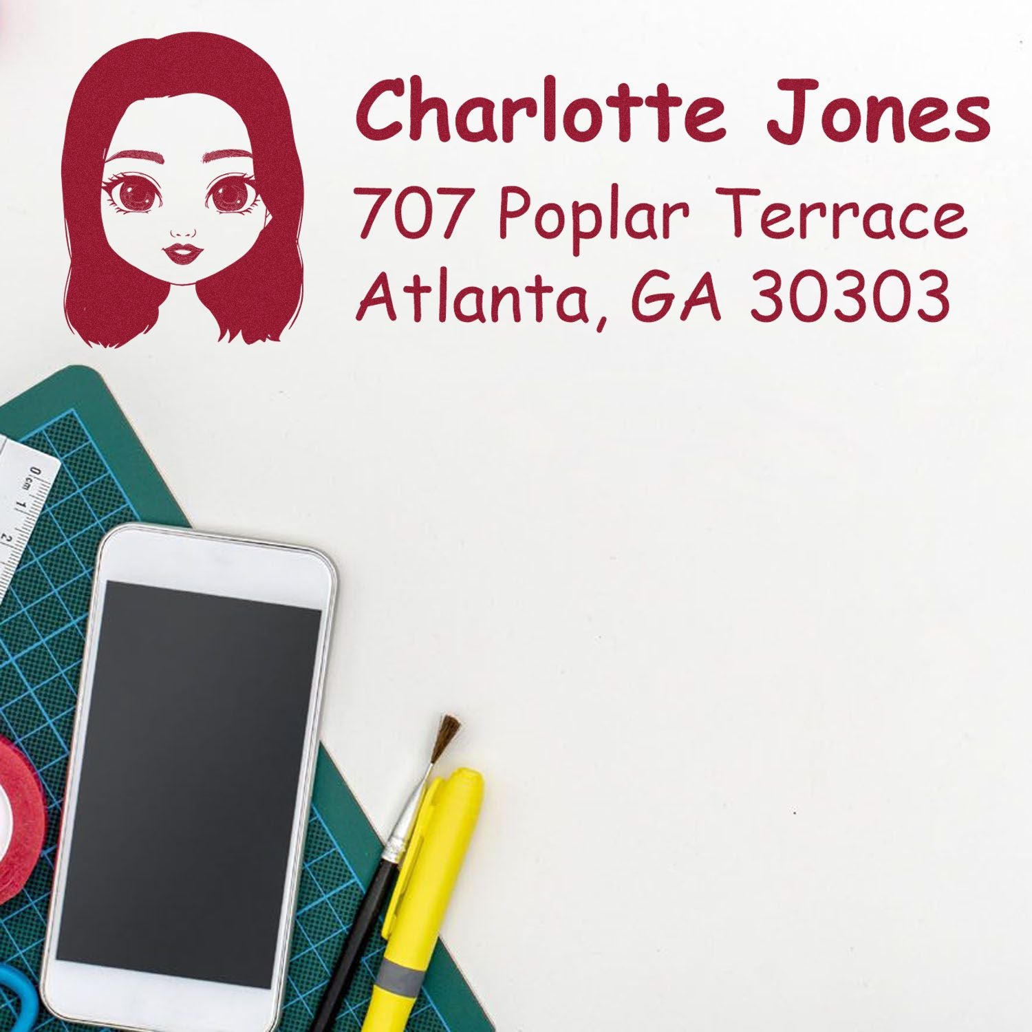 Custom return address rubber stamp with name Charlotte Jones and Atlanta, GA 30303 for mailing labels.