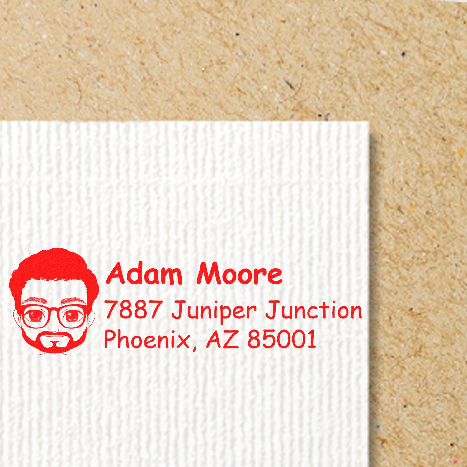 Custom return address rubber stamp with avatar logo for Adam Moore, Phoenix, AZ 85001.