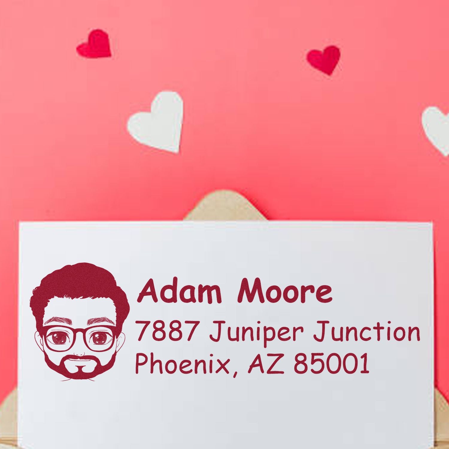 Custom return address rubber stamp with portrait icon, Adam Moore name, and Phoenix, AZ mailing address for envelopes.
