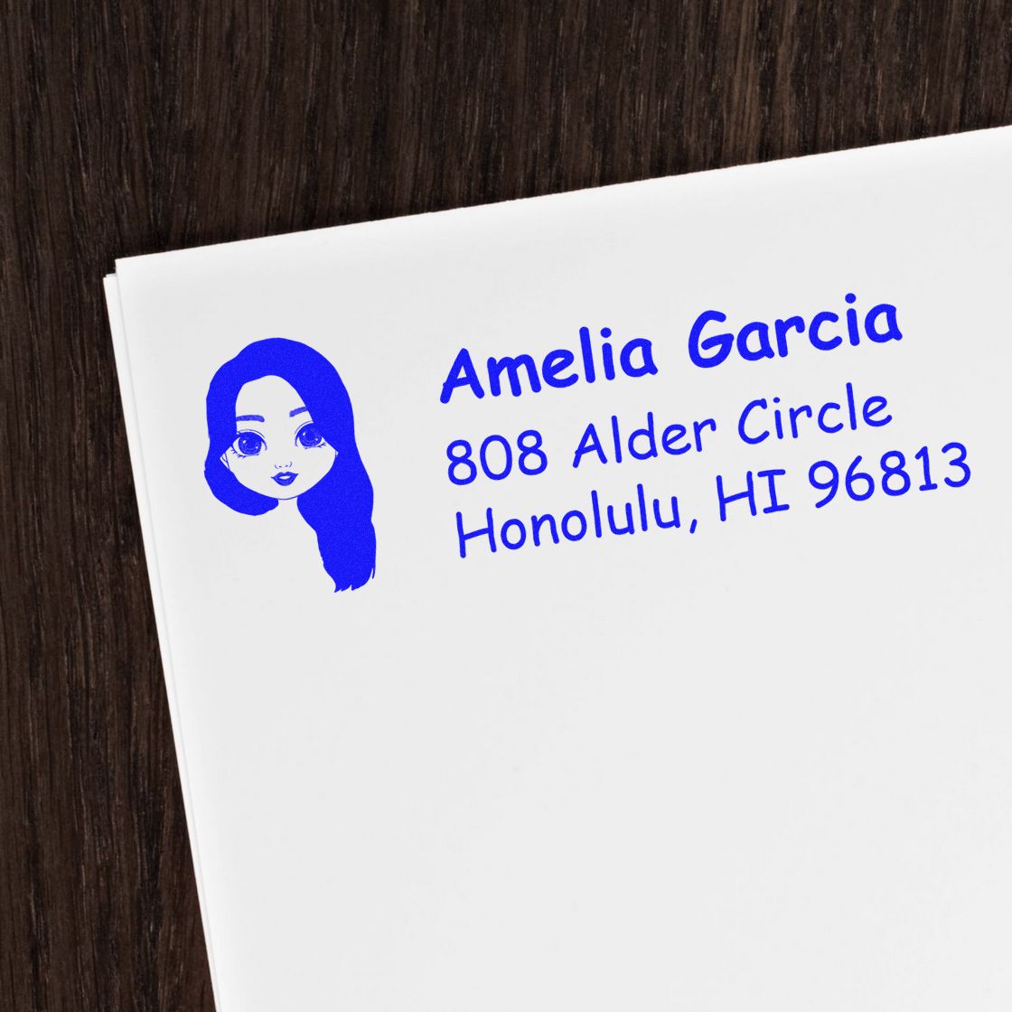 Custom blue return address rubber stamp with woman icon, Amelia Garcia, 808 Alder Circle, Honolulu, HI 96813.