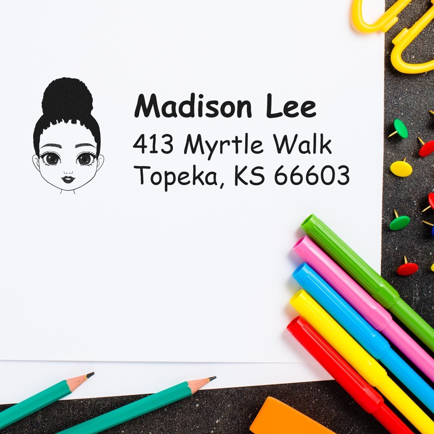 Personalized return address rubber stamp with girl avatar, Madison Lee, and Topeka, KS address, surrounded by colorful stationery.