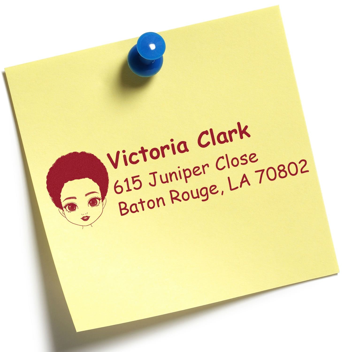 Custom return address rubber stamp on yellow sticky note with blue pushpin, featuring Victoria Clark, Baton Rouge, LA 70802.
